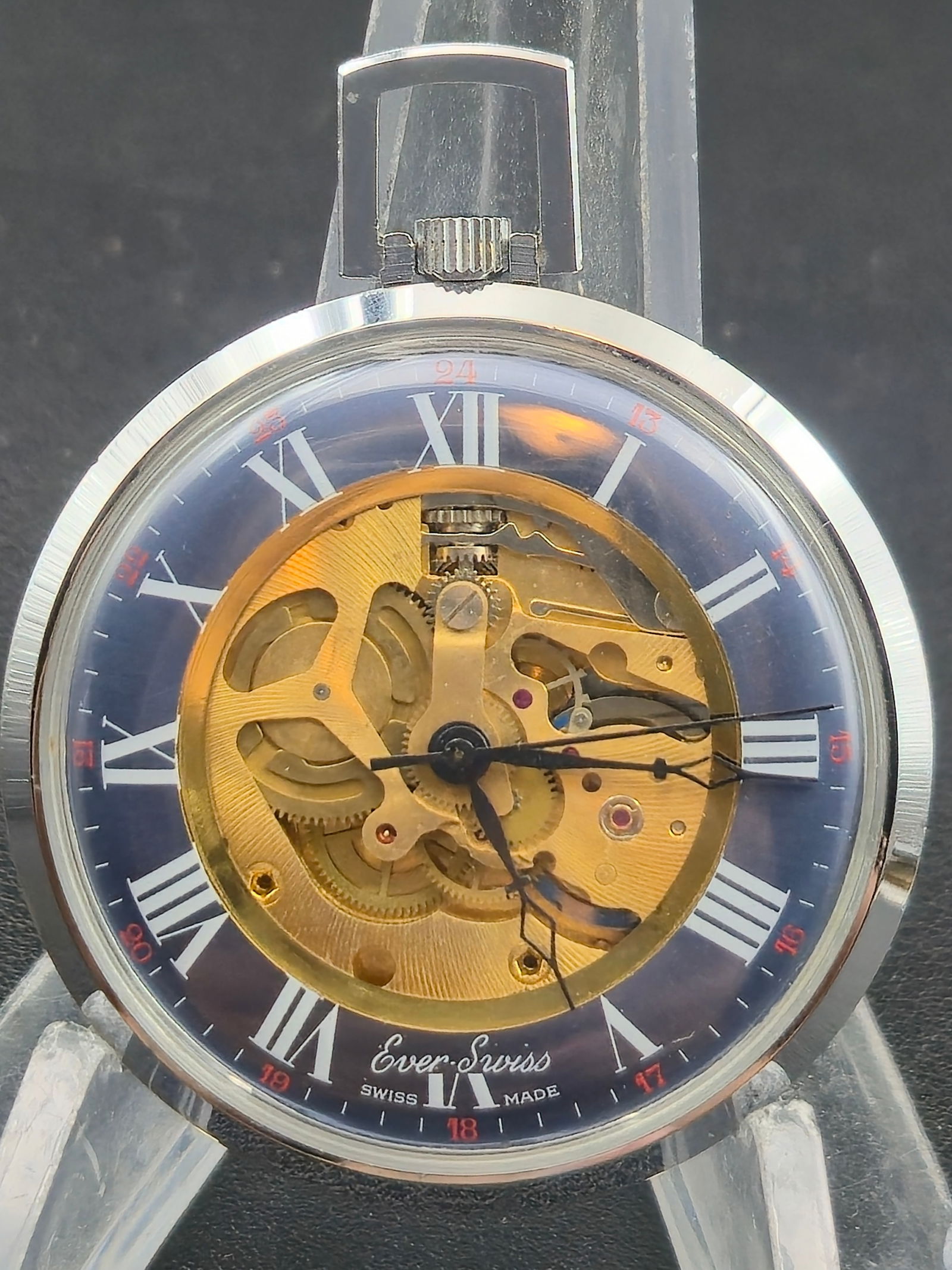 Ever-Swiss Skeleton Pocket Watch – Evaco S.A. V7 17J Movement – Roman Dial – Running: Modern Ever-Swiss skeleton-style pocket watch, powered by a Swiss Evaco S.A. V7 17-jewel manual-wind movement. The mechanism is visible through the open-worked dial, showcasing its bright gilt bridges