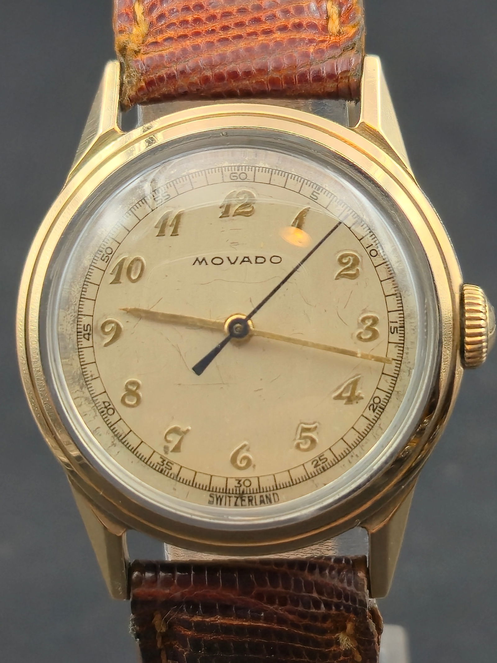 1948 Movado 17J Manual Wind Wristwatch, 29 mm Two-Tone Gold Case “Bank Presentation”: fine vintage Movado wristwatch, presented in 1948 by The First National Bank of Chicago as engraved on the stainless steel back. Features a two-tone gold and steel case with stepped bezel, Swiss-made