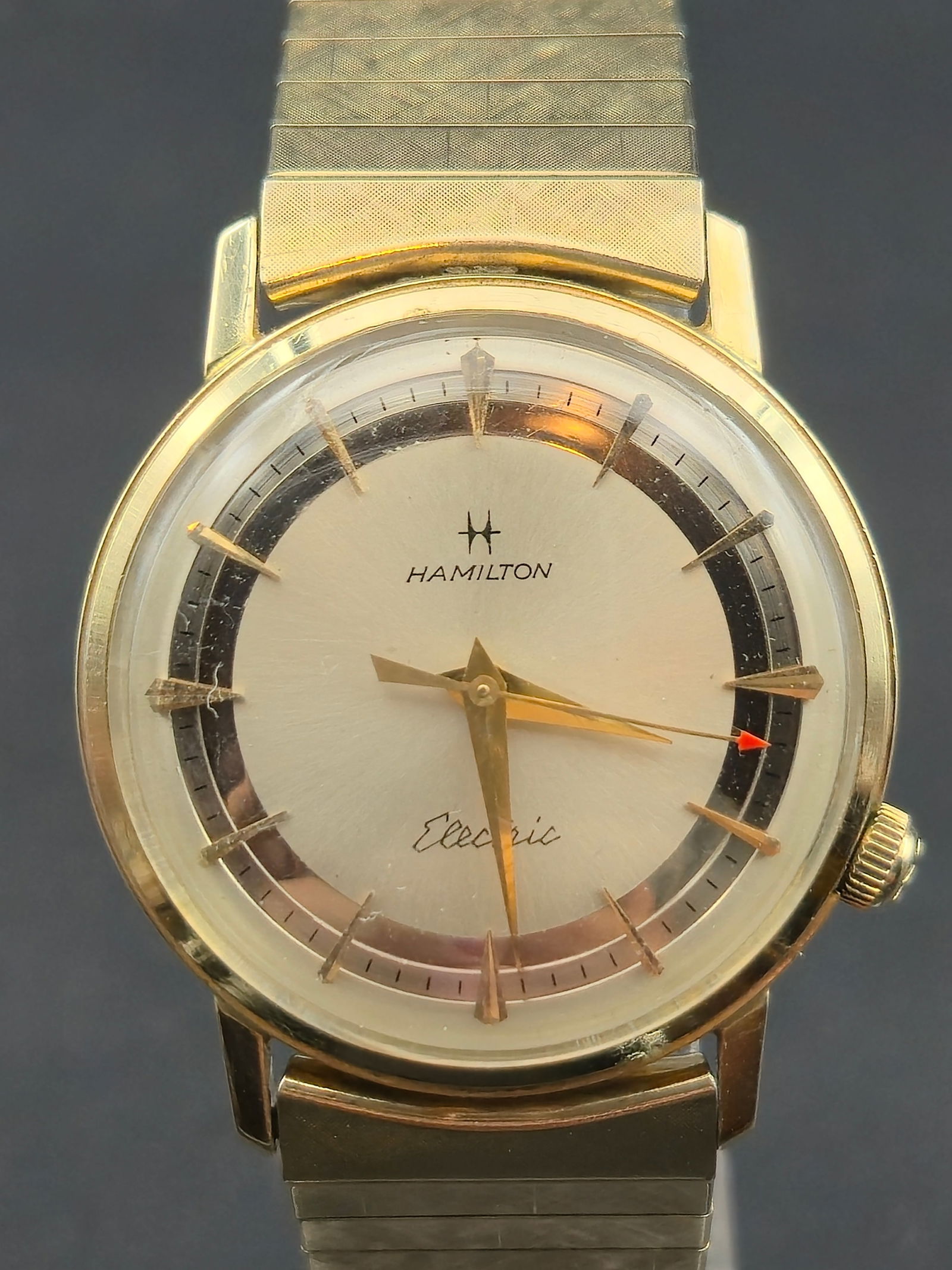 1950s Hamilton Electric Caliber 505 10K Gold Filled 32 mm Wristwatch Starts and Stops: Vintage Hamilton Electric wristwatch featuring the Swiss-American Hamilton Caliber 505 movement, the second-generation electric movement produced by Hamilton Watch Co. The 505 was an improved and more