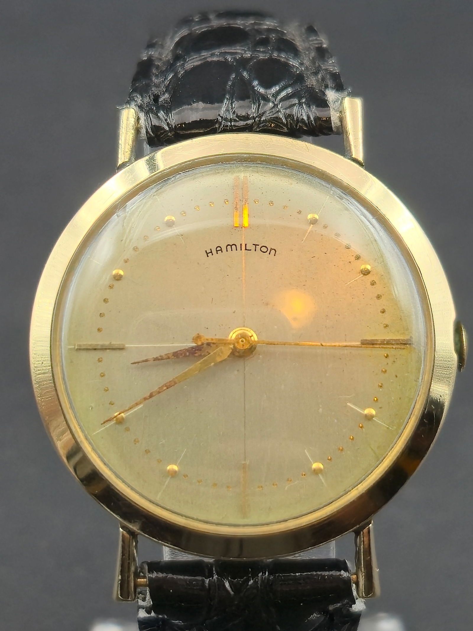 1960s Hamilton Caliber 735 10K Gold Filled 34 mm Presentation Wristwatch: Vintage 1960s Hamilton wristwatch powered by the Hamilton Caliber 735 manual-wind movement with 18 jewels, made in the U.S.A. The watch features a minimalist gold-tone dial signed Hamilton with applie