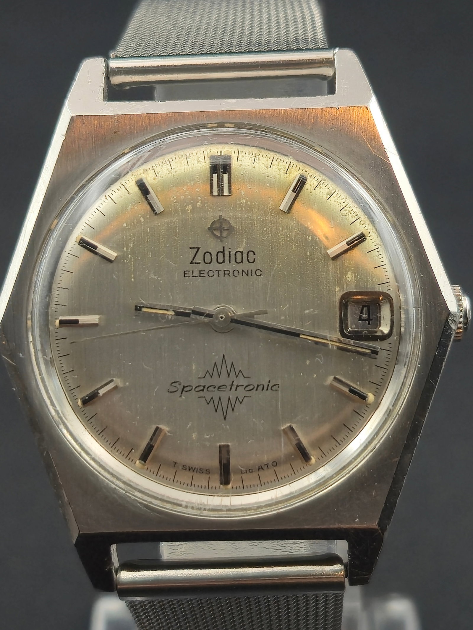 1970s Zodiac Spacetronic Electronic 36mm Men’s Watch Cal. 91 Runs: Circa 1970s Zodiac Spacetronic Electronic wristwatch featuring a distinctive hexagonal stainless steel case and silver sunburst dial with applied indices, baton hands, and date window at 3 o’clock. 