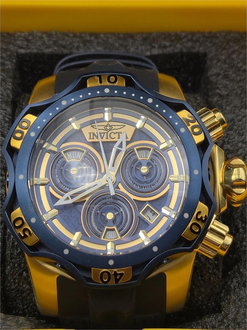 Invicta Venom 38716 Chronograph 1000M Boxed: This bold and oversized Invicta Reserve Venom model 38716 is a statement timepiece built for extreme performance and style. It features a gold-tone and blue case, triple-register chronograph with day