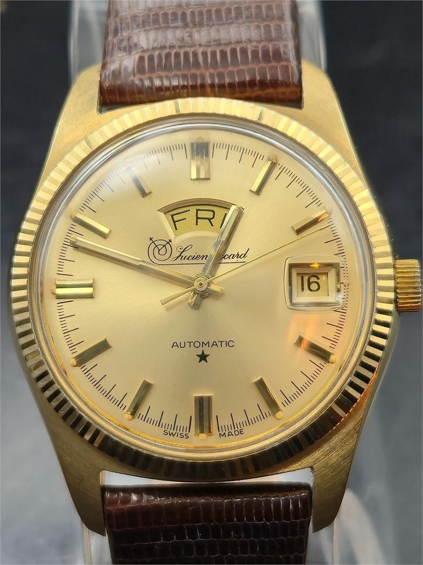 1970s Lucien Piccard Giltron Auto Day-Date 17J: This is a vintage 1930s Albuse Shock Absorber men's wristwatch with classic Art Deco styling. The rectangular case is chrome-plated with ornate engravings at the lugs and bezel, along with gilt accent