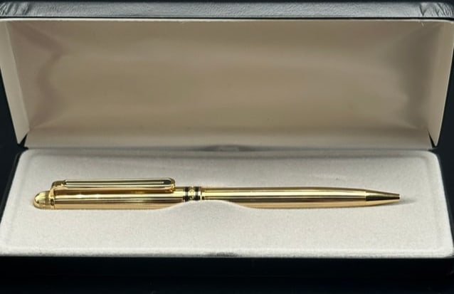 Title: Kreis Germany Gold-Plated Ballpoint Pen with Pinstripe Desi: A sophisticated Kreis ballpoint pen crafted in Germany, featuring a gold-plated finish with classic pinstripe ribbed detailing. The pen is accented with a matching gold clip and band, clearly engraved