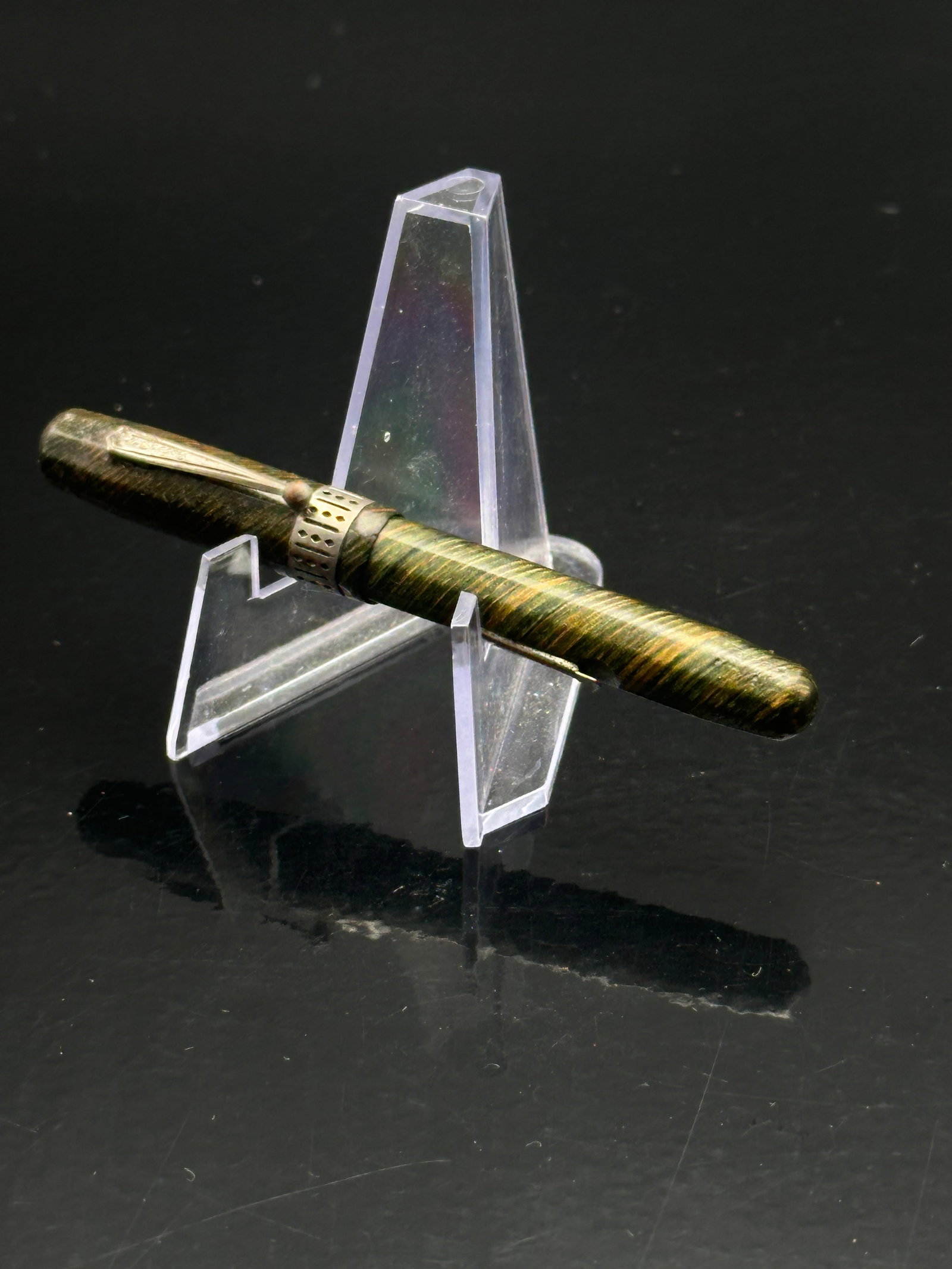 Vintage Parker Fountain Pen – Green & Gold Striated Celluloid, Heart-Shaped Nib, 1930s–40s Era: Classic Parker fountain pen, circa 1930s–40s. Features green and gold striated celluloid barrel with Parker nib bearing the heart-shaped breather hole. Early Art Deco-era craftsmanship with warm pat