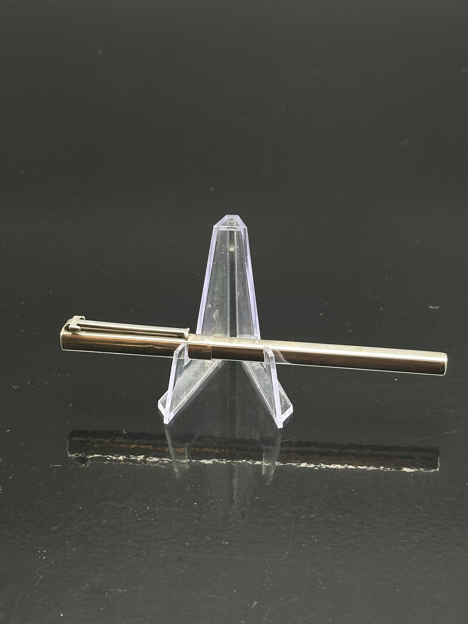 Tiffany & Co. Sterling Silver Ballpoint Pen, Rectangular T-Bar Clip, Vintage: Elegant Tiffany & Co. sterling silver ballpoint pen featuring a sleek rectangular body and distinctive T-bar clip design. Marked “© TIFFANY & CO. STERLING” on the barrel. The pen reflects Tif