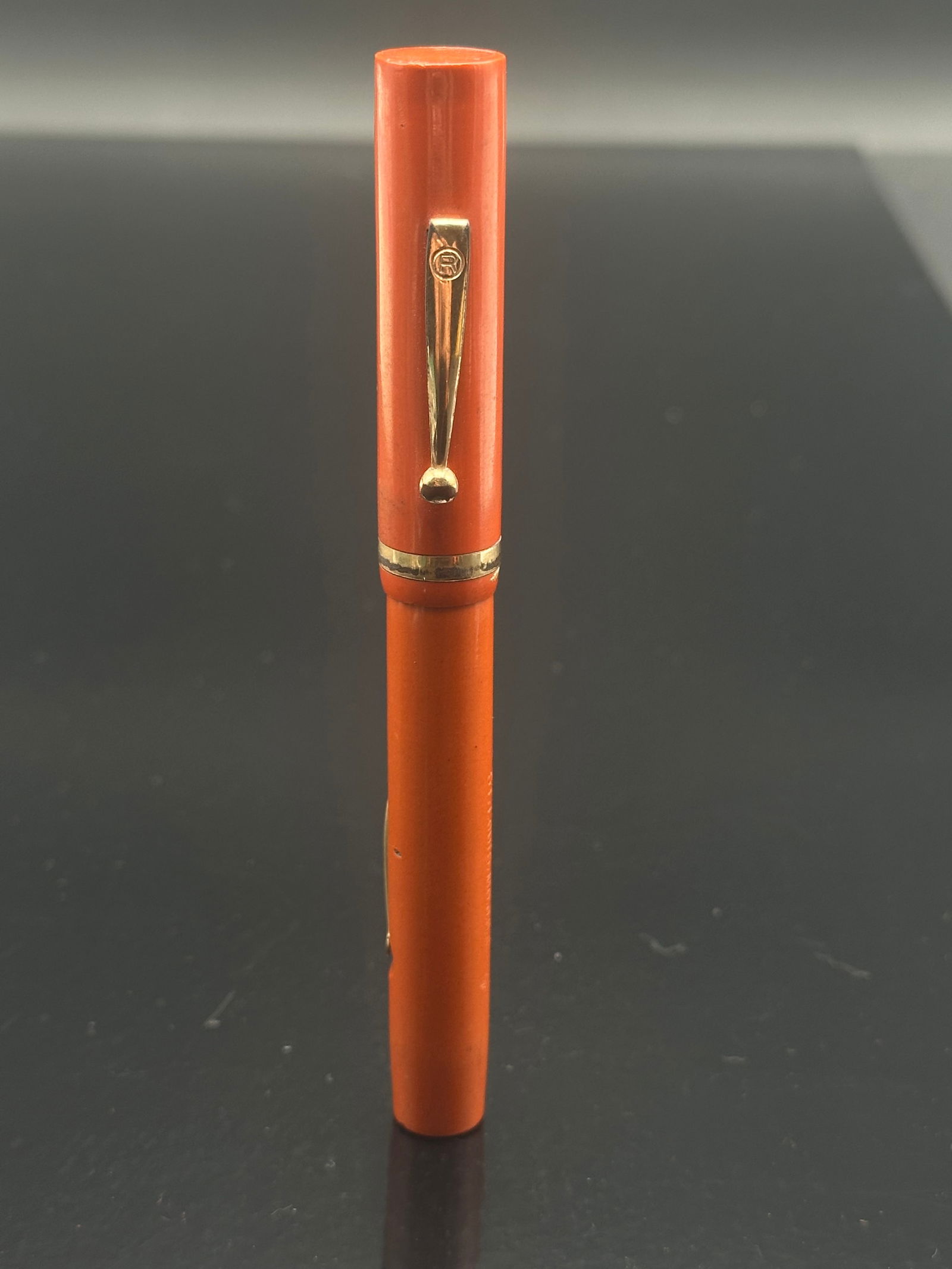 Radium Point Pen by Jos. Lipic – Hard Rubber Eyedropper Fountain Pen – Lipic No. 6 Gold Nib –: A striking early Radium Point Pen manufactured by the Joseph Lipic Pen Company of St. Louis, Missouri, featuring a bright orange hard rubber body with gold-plated clip and cap band. The barrel is clea