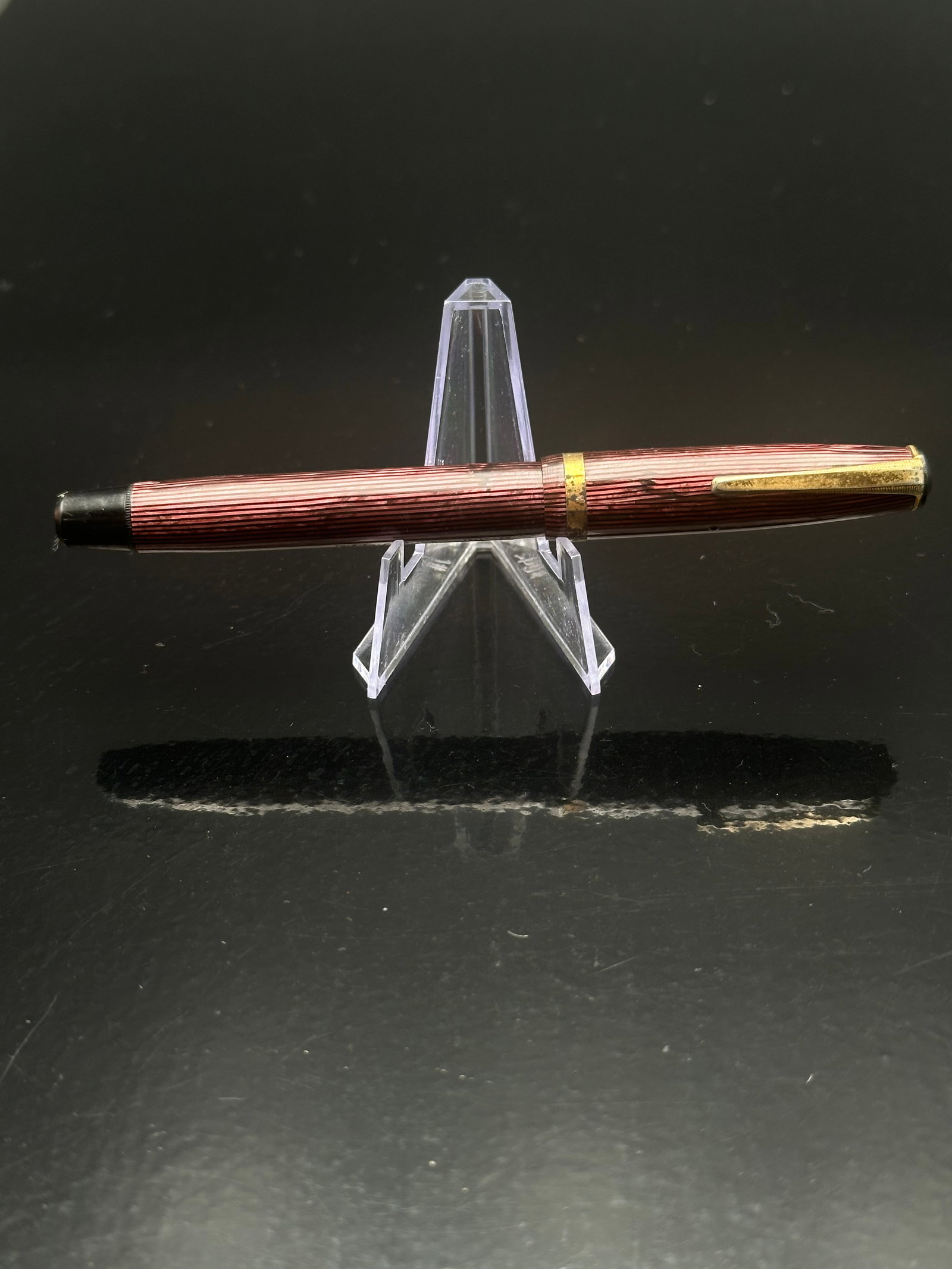 Wearever Pennant Burgundy Fountain Pen – Iridium-Tipped Nib – Striped Barrel – Made in USA, c.: This classic Wearever Pennant fountain pen features a burgundy striped barrel and cap with gold-toned trim and clip. The barrel is imprinted “Wearever – North Bergen, New Jersey, U.S.A.” The