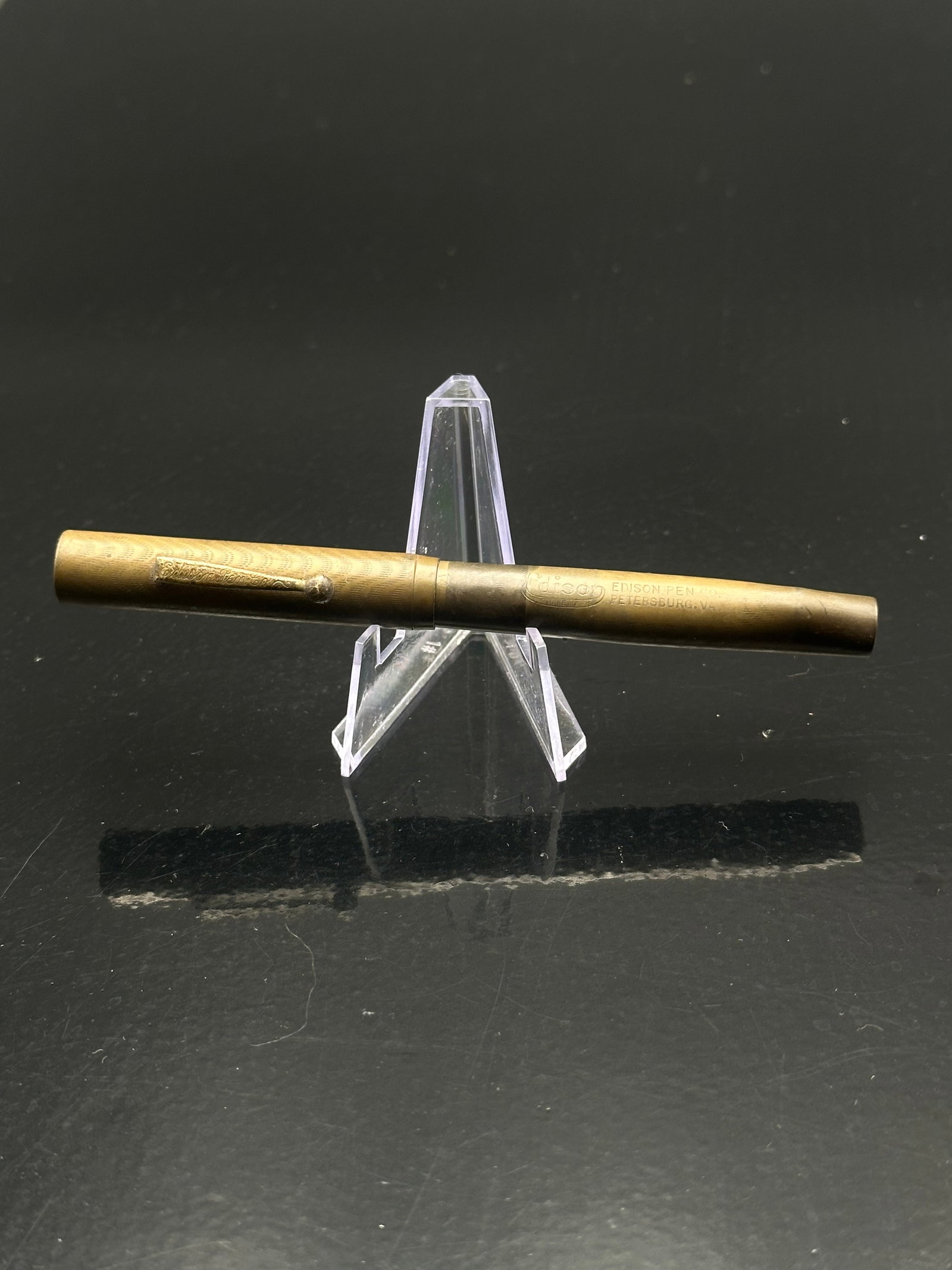 Vintage Edison Fountain Pen, Petersburg VA — Gold Nib, Ripple Hard Rubber: A fine early Edison Fountain Pen manufactured by the Edison Pen Co. of Petersburg, Virginia. The barrel is imprinted “Edison Pen Co. Petersburg, VA” and features a mottled or ripple hard rubbe