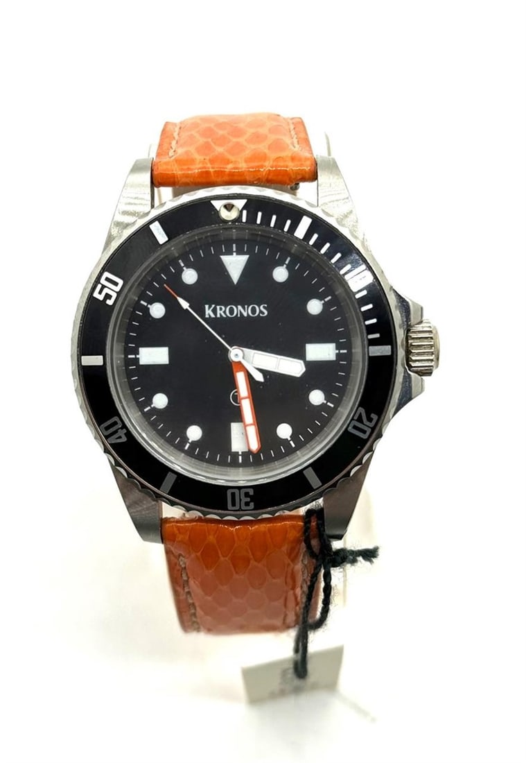 Kronos Divers style watch: Kronos brand divers style watch. Luminous hands and number indicator. Orange snakeskin leather band. Automatic in working order. Thanks for looking at our auction.