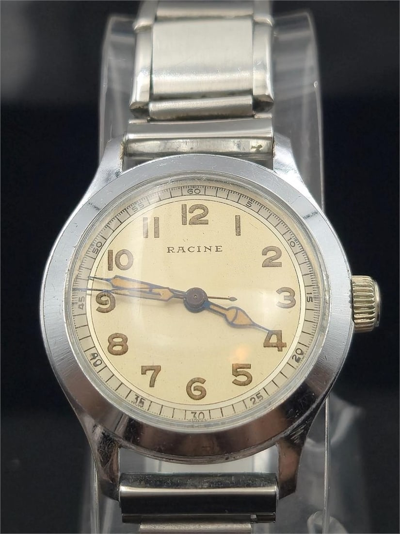 Racine 17J Swiss Manual – Radium Dial, Running: Vintage Racine Swiss men's wristwatch featuring a 17-jewel Lathin manual wind movement. The watch has a bold mid-century aesthetic with a radium-lumed dial, luminous hands, and Arabic numerals. Housed
