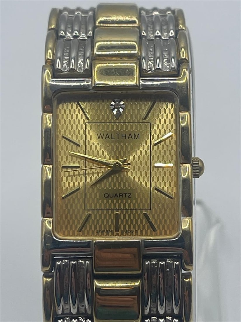 Men’s Waltham Diamond Accent Black Dial Gold Tone: Key Features:In working condition.• Brand: Waltham• Movement: Mechanical (Hand-Wound)• Case Material: Gold-Tone Stainless Steel• Dial: Black with Diamond Accents• Display: Ana