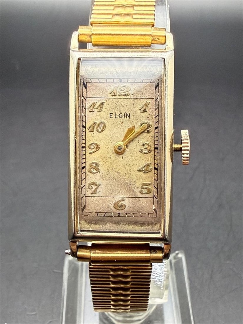 Vintage Elgin Mechanical Curved Dress Tank Watch: Running condition.The watch is sold as-is in current condition.Thank you for viewing this auction. We are a dedicated team of vintage watch and antique enthusiasts with years of experience in collecti