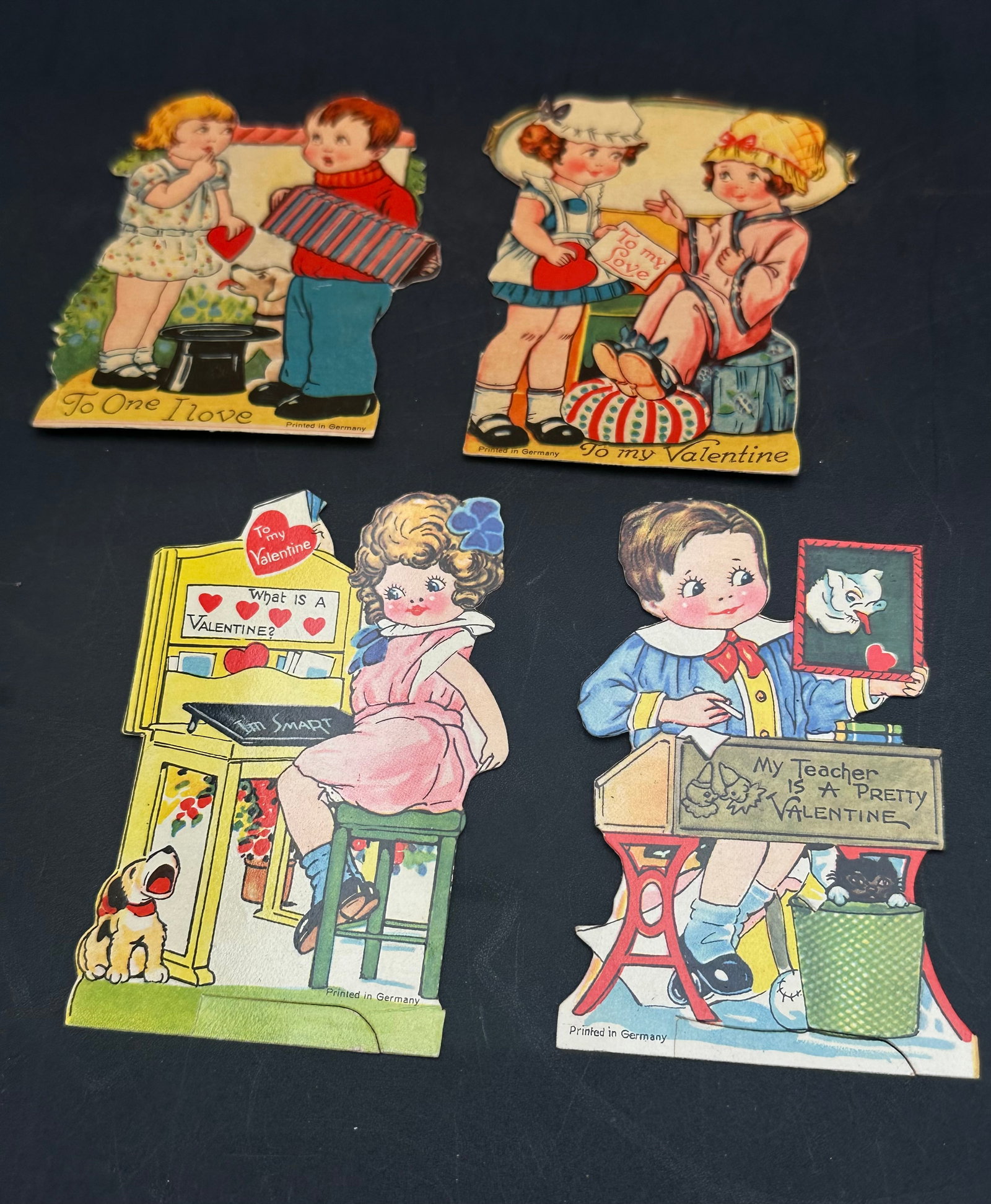 Set of 4 Vintage 1930s “Printed in Germany” Die-Cut Valentine Cards: Charming set of 4 original 1930s Valentine’s Day cards, all beautifully lithographed and marked “Printed in Germany.” Each features adorable children, bright colors, and sweet messages like 