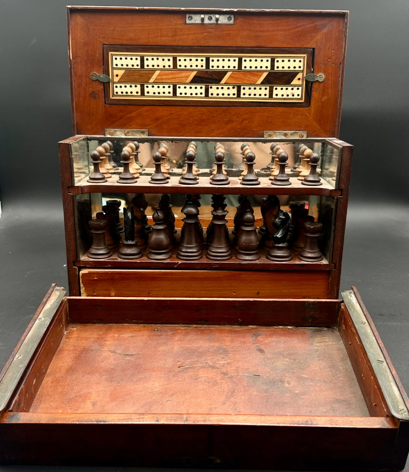 Victorian Mahogany Chess & Cribbage Compendium Box with Mirrored Interior: Elegant 19th-century Victorian era mahogany gaming compendium featuring a double-level storage design with mirrored interior and a fine set of turned wooden chessmen. The hinged lid opens to reveal an