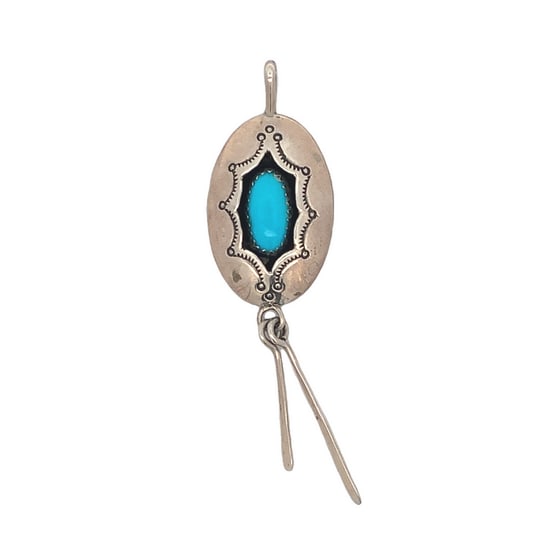 J. Manuelito Navajo Sterling Silver Turquoise Pendant with Dangles: Handcrafted Navajo sterling silver pendant by artisan J. Manuelito, featuring a vibrant turquoise cabochon set in an oval bezel with traditional stamped detailing and silver dangles below. Marked STER