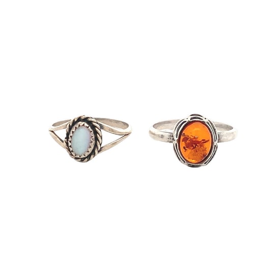 Pair of Sterling Silver Rings with Amber & Mother of Pearl Cabochons, 4.6g Total: Charming pair of vintage sterling silver rings, each bezel-set with an oval cabochon — one featuring warm amber (8.5mm), and the other showcasing iridescent mother of pearl (7mm). Both are handcraft