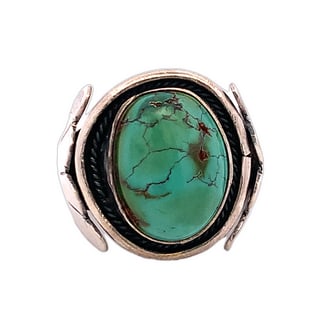 Large Oval Turquoise Ring with Feather Motif, 18g, Size 9.25: Bold statement ring featuring a large oval turquoise cabochon with natural brown veining, set in a wide silver-tone band with feather-like side details. The top measures approximately 18mm, and the ba