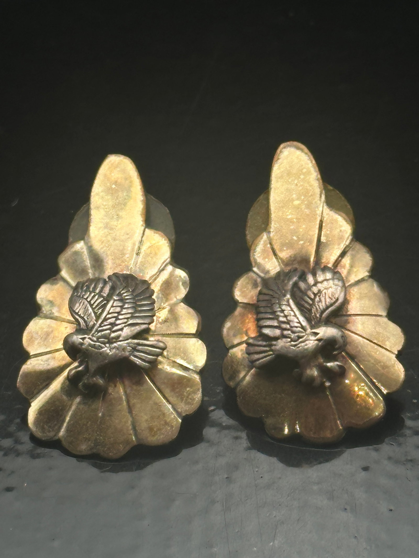 Running Bear Sterling Silver Eagle Concho Earrings, 11 g: Pair of vintage sterling silver earrings by Running Bear Trading Co., featuring detailed eagles in relief on scalloped concho forms. Marked “RB Sterling.” Total weight 11 g.