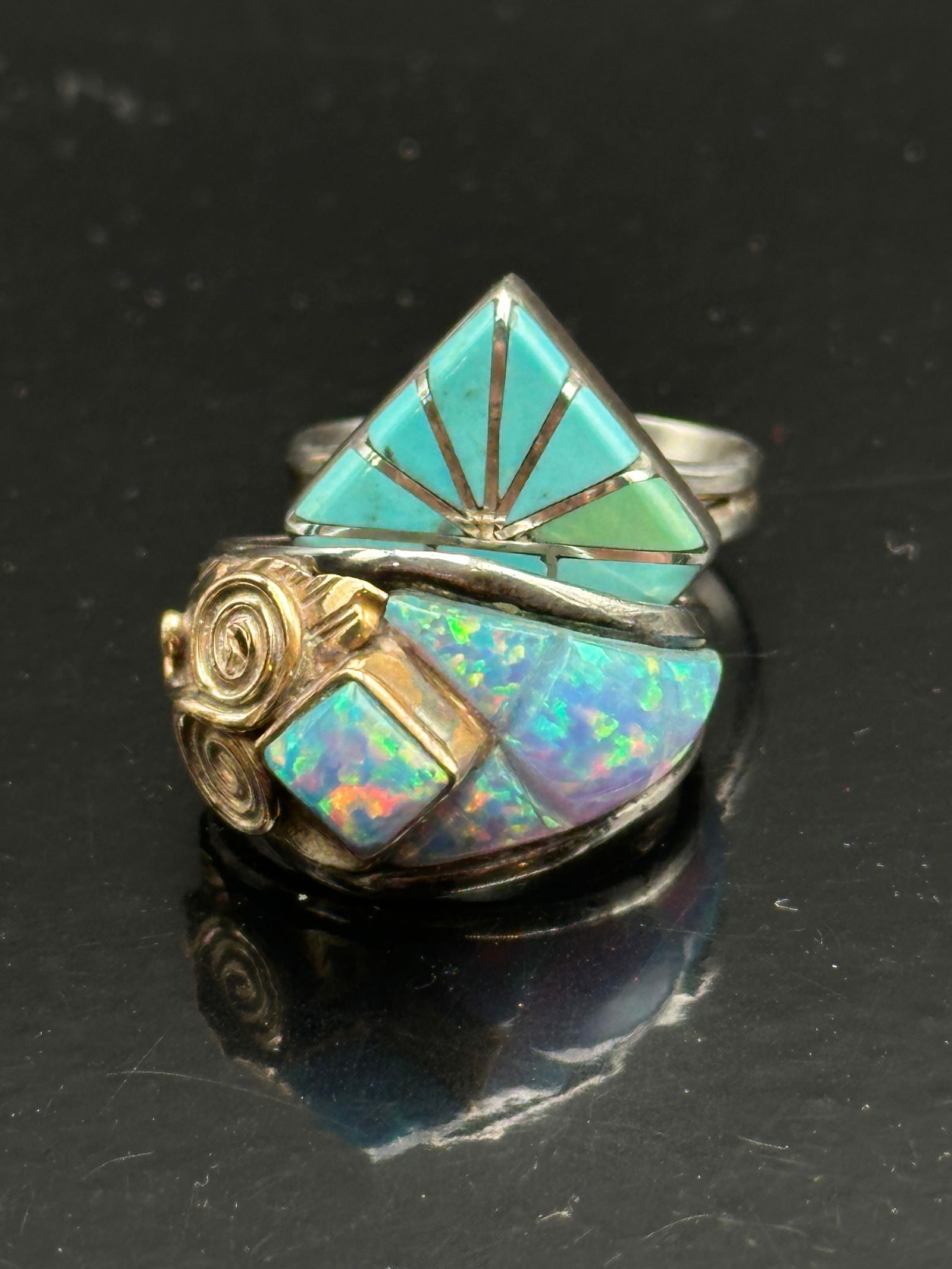 Southwest Sterling Silver Rings Lot – Turquoise Inlay & Opal Artisan Designs: Pair of contemporary Southwest sterling silver rings. One showcases a striking geometric turquoise inlay pattern in a diamond shape with silver channel lines forming a sunburst motif. The other featur