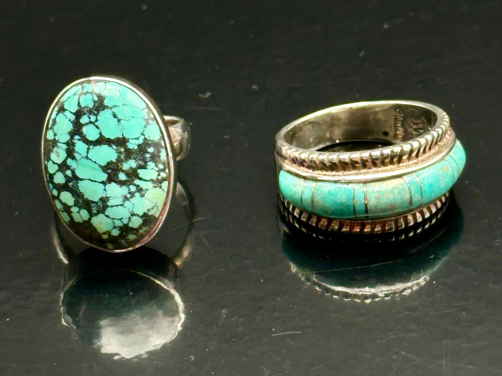 Pair of Sterling Silver Turquoise Rings – Spiderweb & Inlay, 19g: Beautiful pair of handcrafted sterling silver turquoise rings. One features an oval spiderweb turquoise cabochon in a classic Navajo-style bezel setting. The other showcases turquoise inlay bordered b