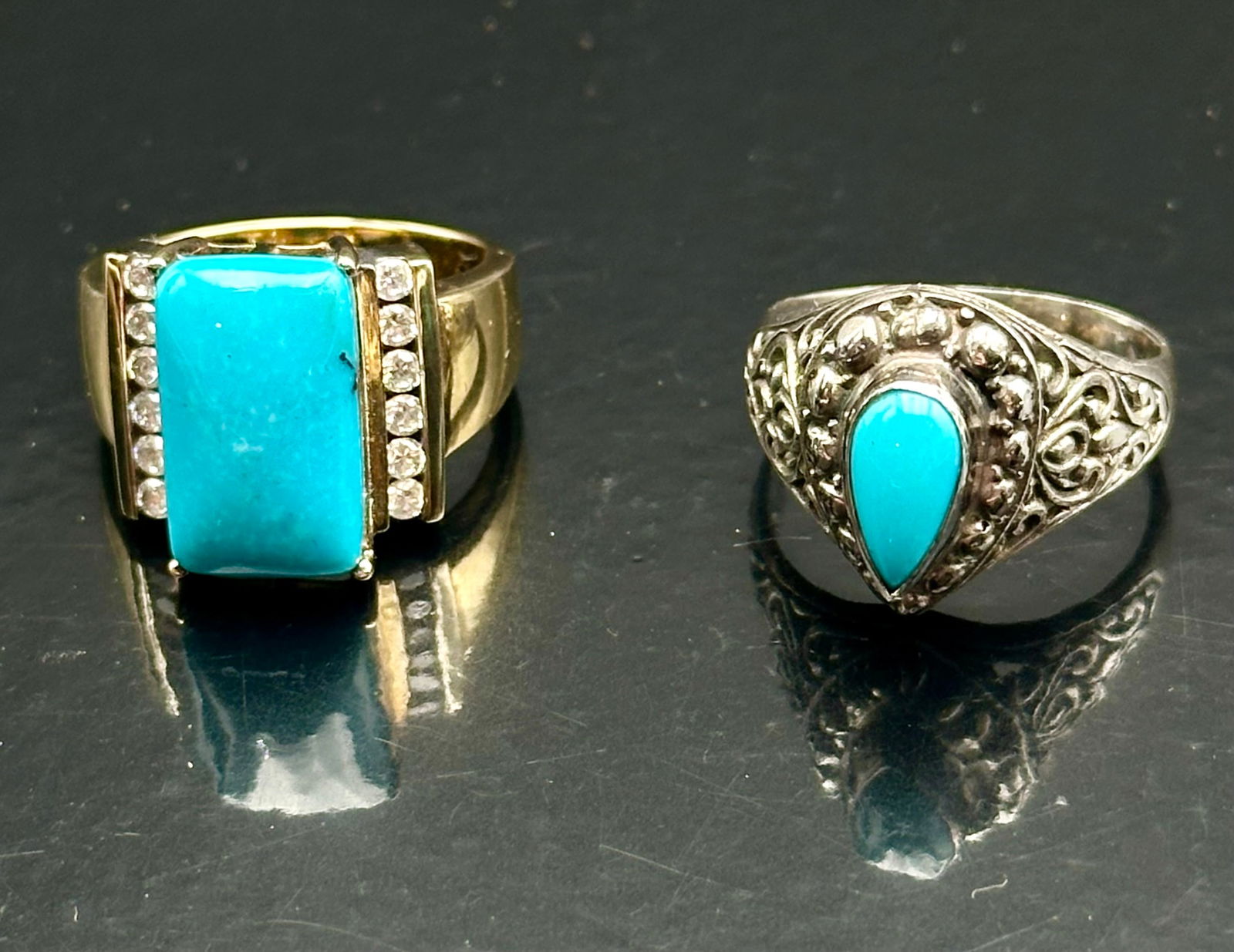 Pair of Sterling Silver Turquoise Rings – Sleeping Beauty & Rectangular Design, 14g: Beautiful pair of genuine sterling silver turquoise rings. One features a vivid Sleeping Beauty turquoise teardrop cabochon (approx. 1.02 ct) in an ornate filigree setting. The second showcases a rect