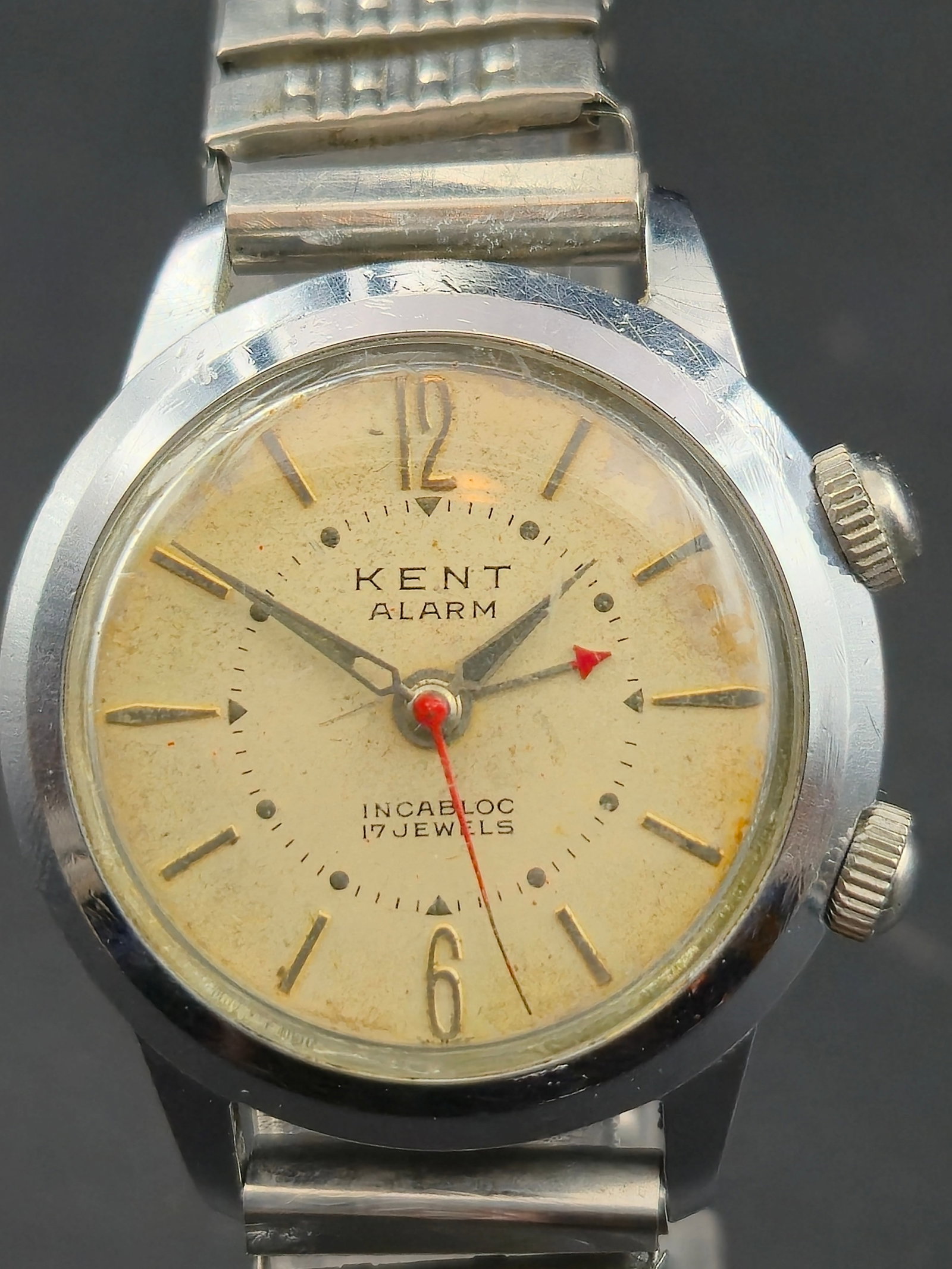 Kent Alarm 17J Swiss Manual Wind Dual Crown Watch (1950s, 33mm): This vintage Kent Watches Inc. Swiss alarm wristwatch features a dual-crown design housing a mechanical alarm complication, powered by a 17-jewel Swiss manual-wind movement with Incabloc shock protect