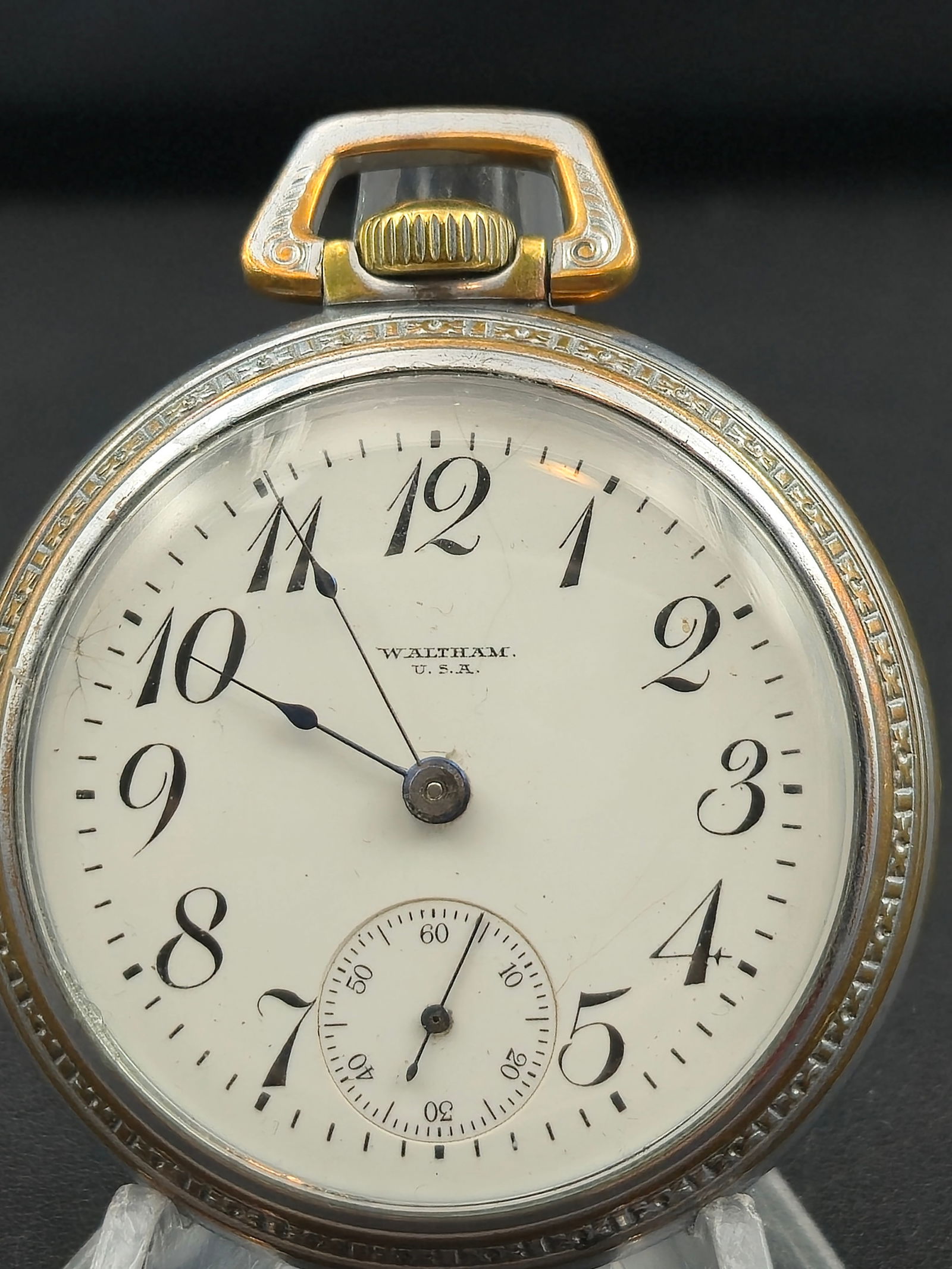 1917 Waltham Grade No. 18 18s Pocket Watch – Silveroid Case – Running: Offered is a 1917 Waltham Grade No. 18 pocket watch featuring the classic 7-jewel, full-plate movement (serial 21779915) with a nickel finish, safety pinion, and Breguet hairspring. This Model 1883 mo