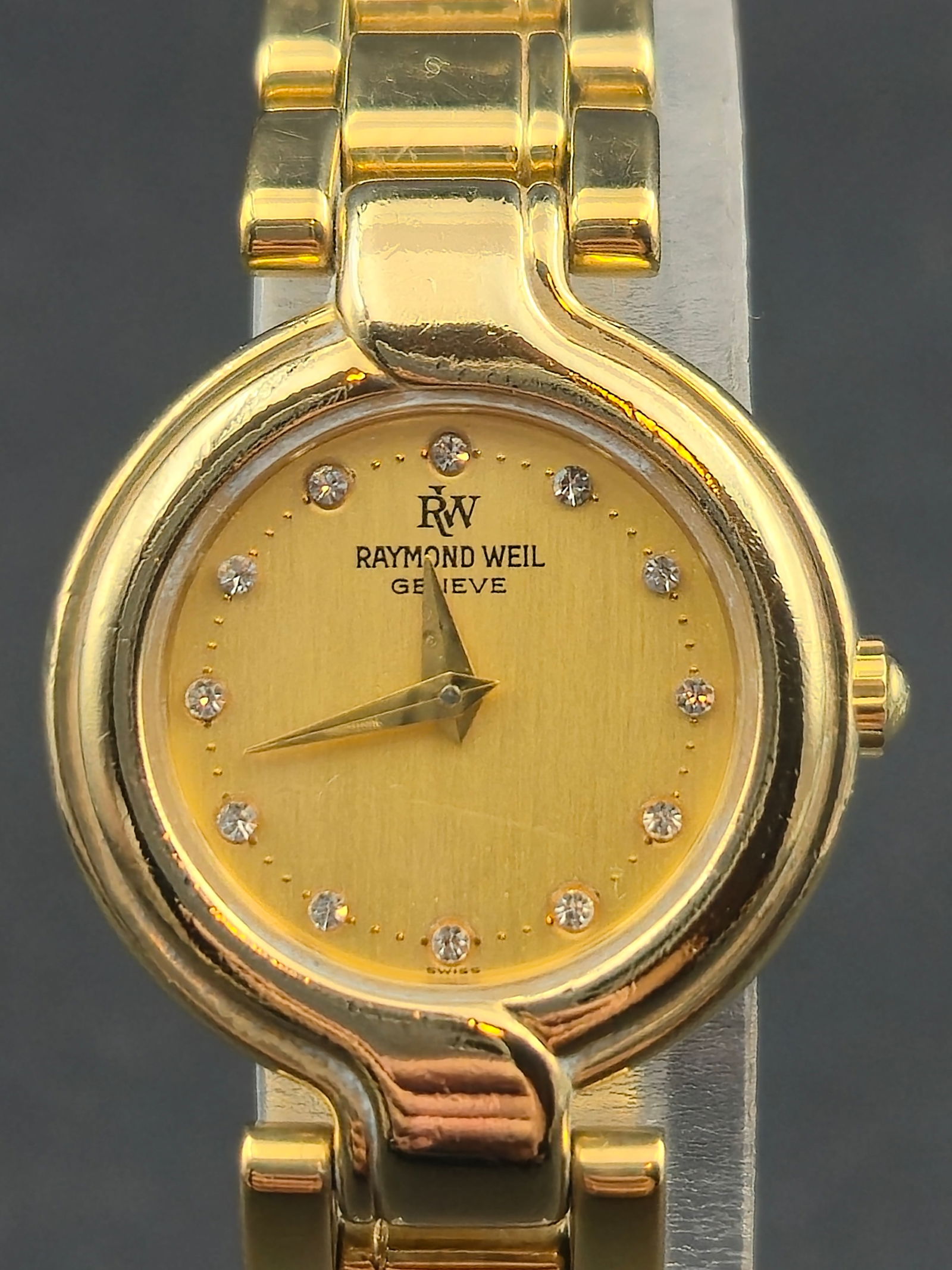1990s Raymond Weil Ref.5850 Gold Crystal Dial 23mm Ladies 18K GP Quartz Watch – Running –: Beautiful 1990s Raymond Weil Geneve ladies’ quartz watch, reference 5850, featuring a gold “Crystal Dial” design with 12 diamond-style crystal markers. The watch is running and keeping time