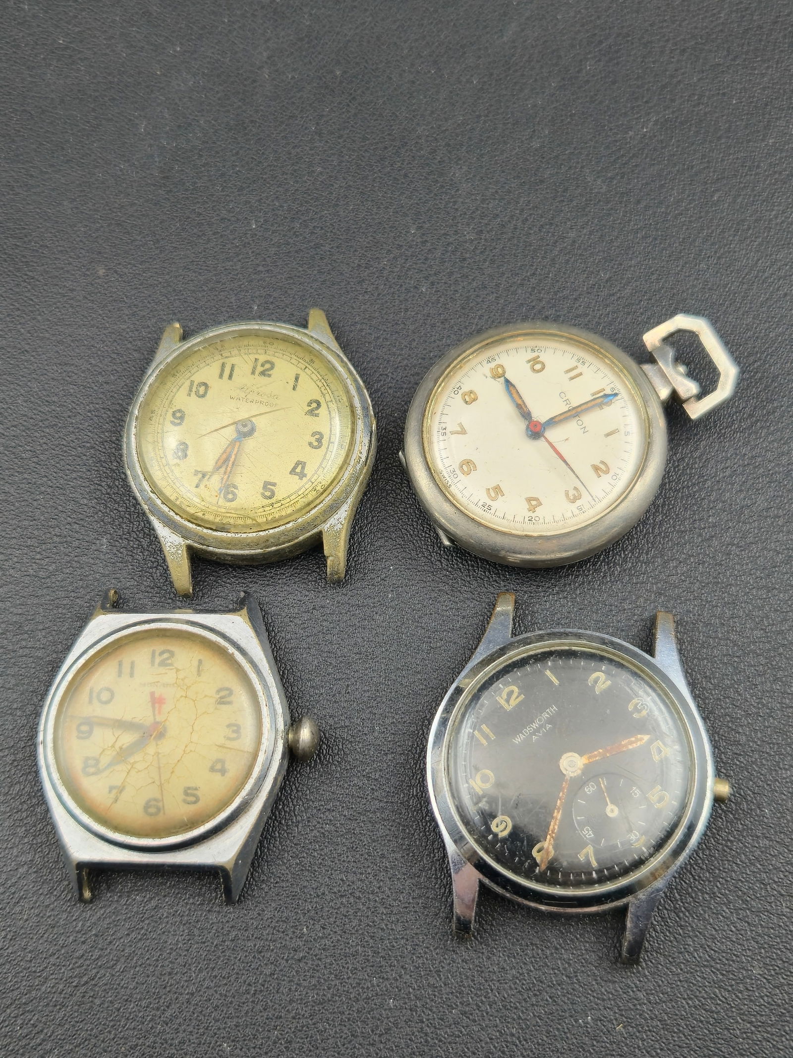 Vintage 1940s–1950s Watch Lot – Croton .925 Silver Pocket Watch, Monarch, Avia, Artista –: Lot of four vintage mid-century timepieces including a sterling silver Croton pocket watch, Monarch 17-jewel wristwatch, an Avia/Wadsworth black-dial sub-seconds watch, and an Artista waterproof wrist
