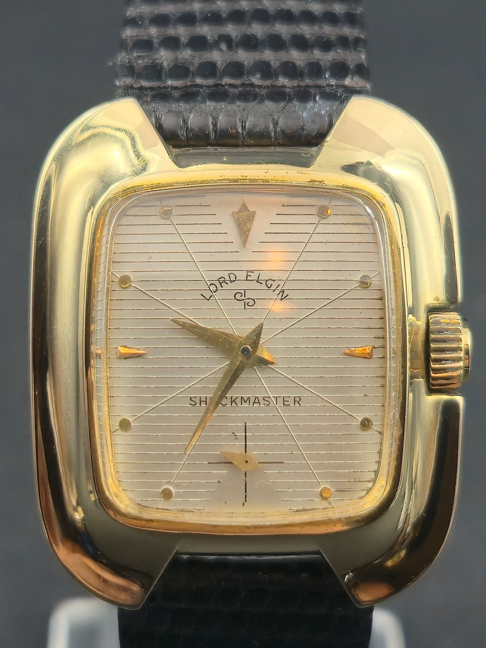 1950s Lord Elgin “TV-Case” / Rectangular Dress Watch (Art Deco-Inspired: Vintage 1950s Lord Elgin Shockmaster wristwatch featuring a 10K gold-filled case with a striking rectangular design and sculpted corners. The silver dial has a unique cross-hair striped pattern, appli