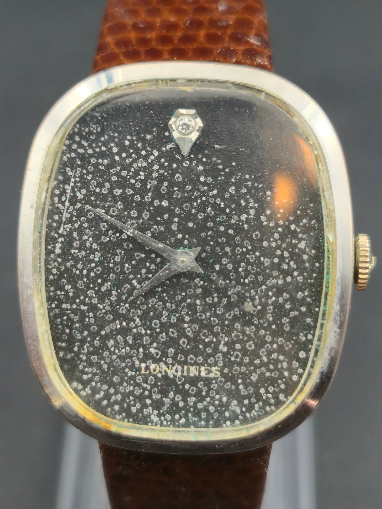 1970s Longines 10K White Gold-Filled Cushion Dress Watch 27mm Ref. 3056-528 Diamond Dial: Vintage 1970s Longines dress watch in a cushion shaped 10K white gold filled case made by Star Watch Case Co. Reference 3056 528. Features a black speckled stardust style dial with a diamond set marke