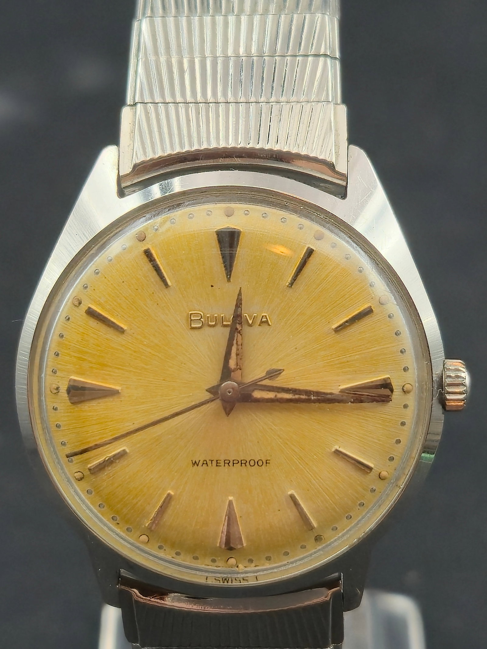Bulova Waterproof Stainless Steel 32 mm 1965 Runs Vintage Swiss Dial: Vintage 1965 Bulova stainless steel wristwatch with a sunburst yellow Swiss dial and original applied hour markers. The watch is running and keeping time. Service recommended due to age. Shock resista