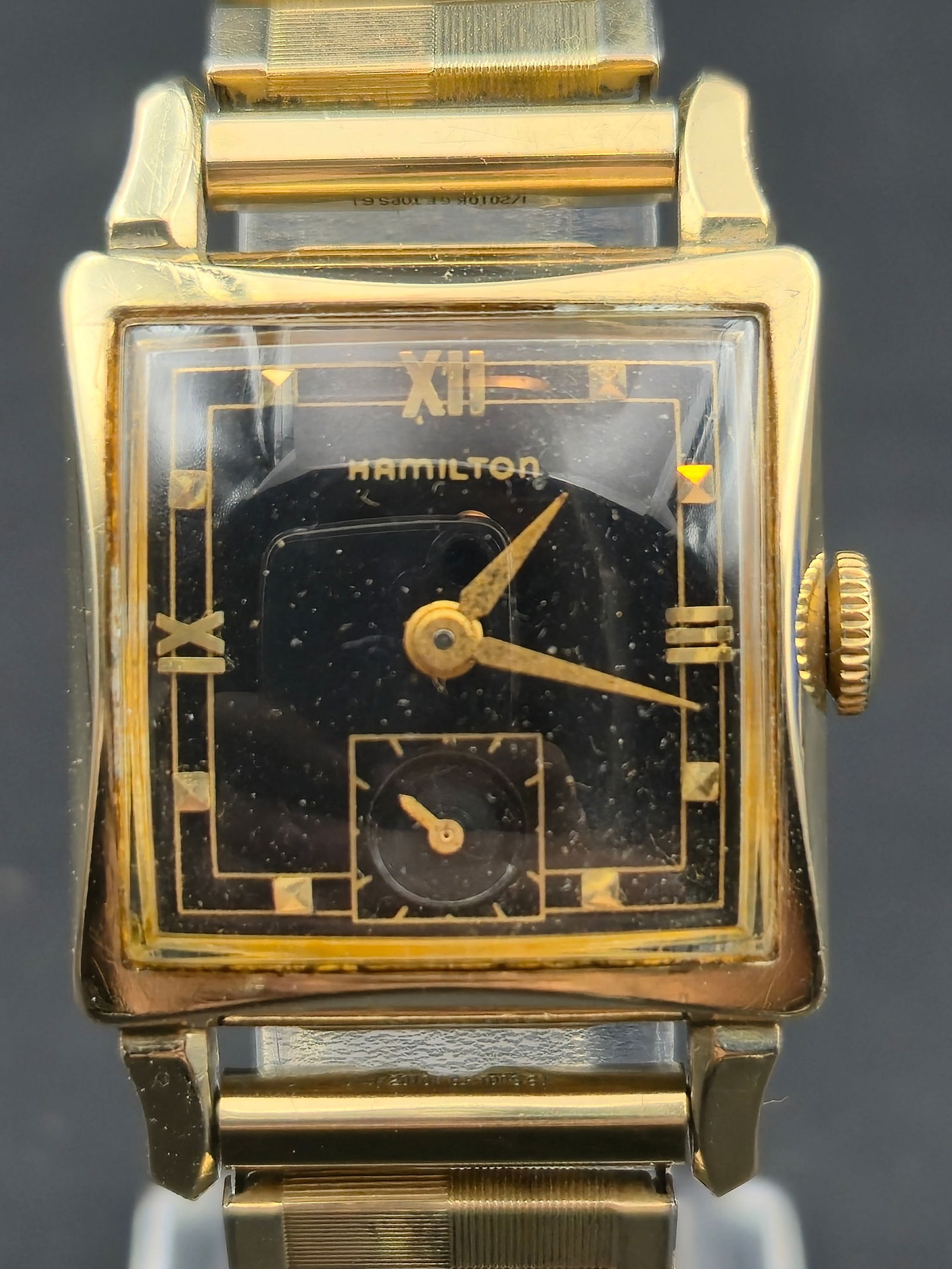 1948 Hamilton Ryan 10K Gold-Filled 25mm Black Dial 17J Manual Wind Runs Vintage Dress Watch: A 1948 Hamilton Ryan in 10K gold-filled L&K case with the rare black gilt dial and original expansion bracelet. Powered by Hamilton’s 17-jewel Grade 752 manual-wind movement, this vintage rectangula