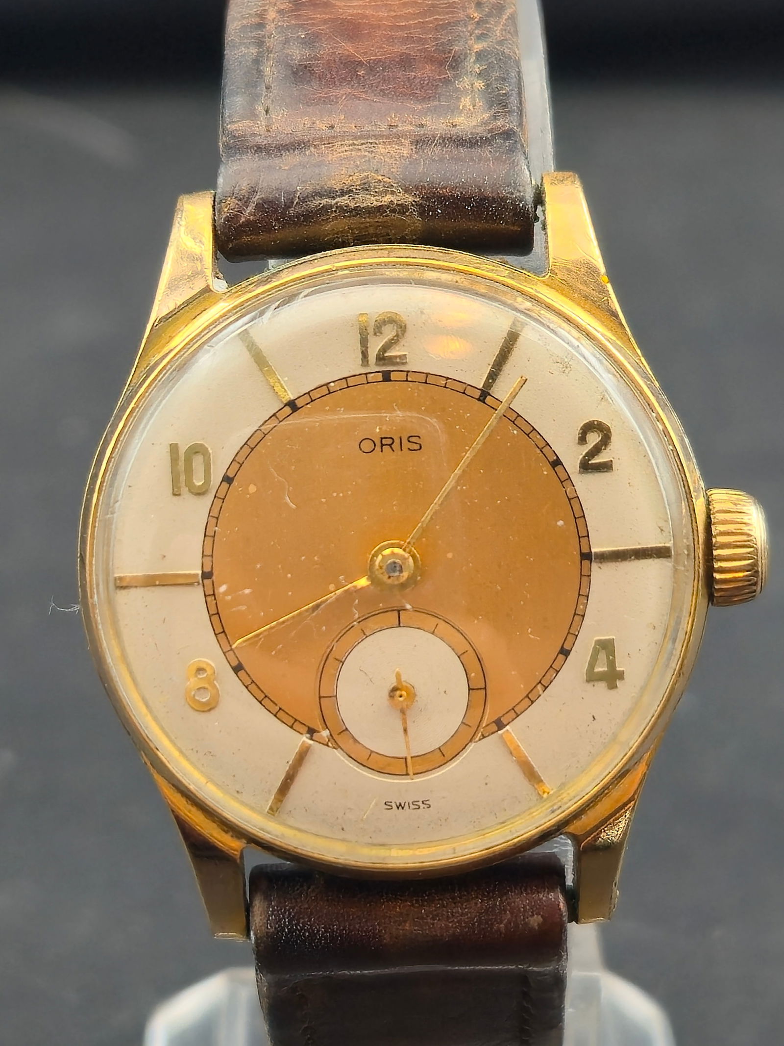 1940s Oris 10K GF “Two-Tone Sector Dial” 30mm – Cal. 451 – 7J: This 1940s Oris features a rare two-tone sector dial with champagne center, bold Arabic numerals, and a prominent sub-seconds register. Housed in a 10K gold-filled case with stainless steel back and p