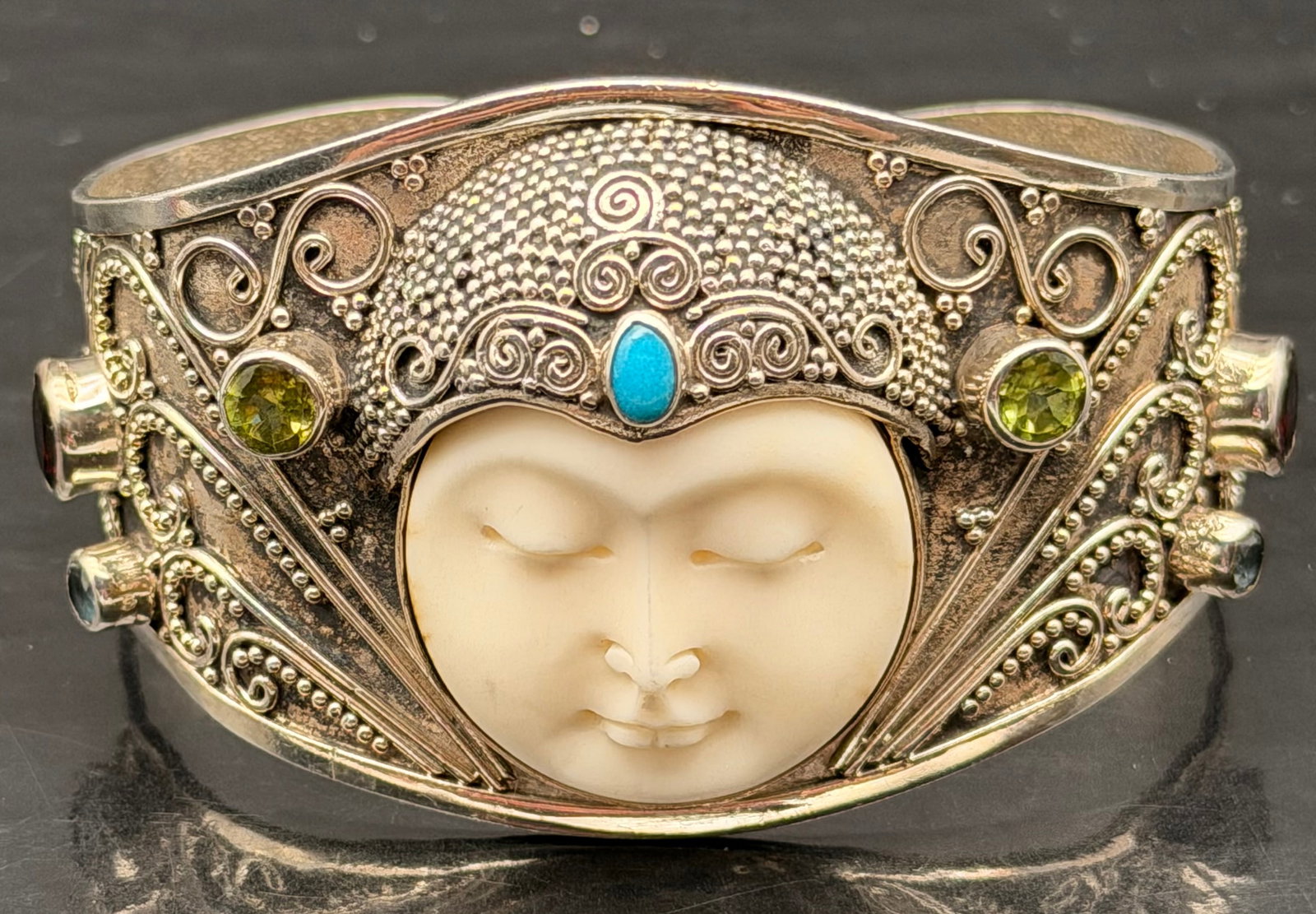 Hand Carved Bone, Silver, and Gemstone Cuff Bracelet: Serenely beautiful, the milky face of the moon appears to glow from within. Buana of Bali presents this beautiful cuff bracelet.