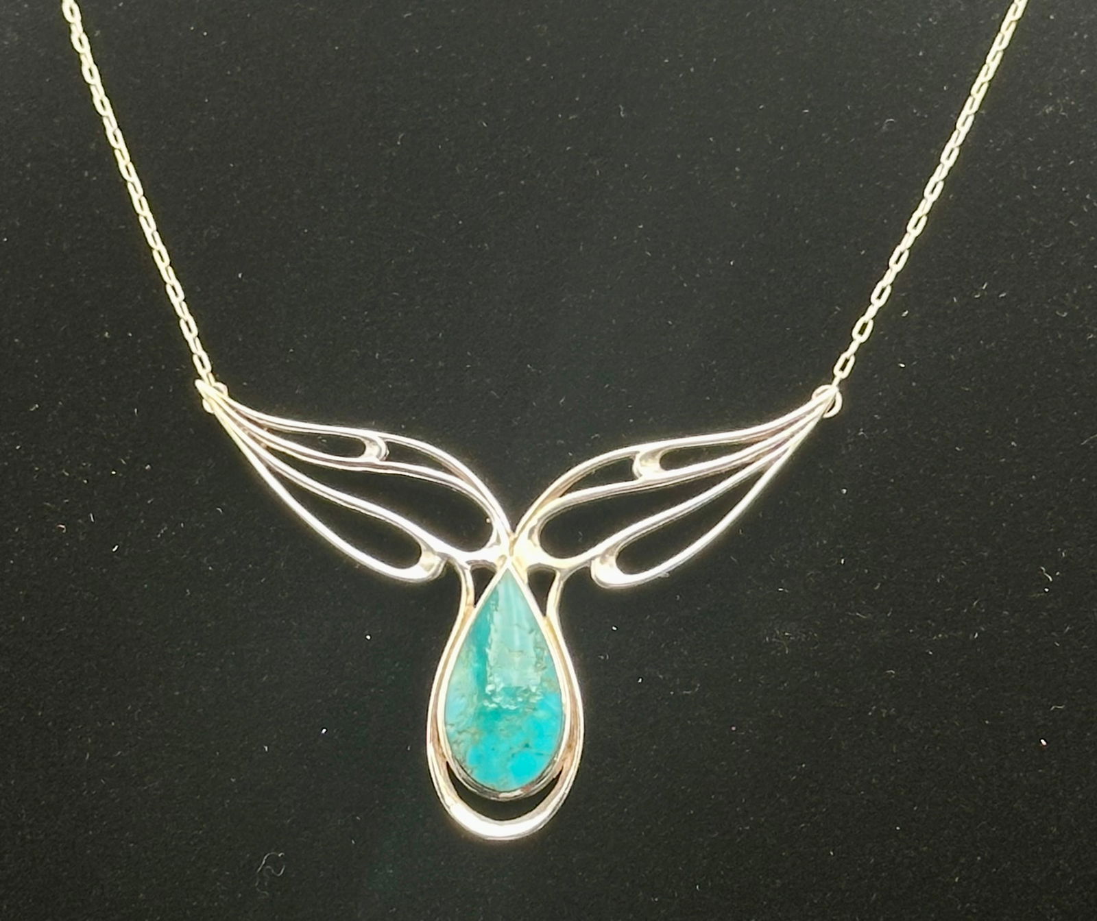 Vintage Sterling Turquoise Teardrop Necklace – Signed KBN – 11g: Vintage sterling silver necklace with openwork wings and a turquoise teardrop stone. Signed KBN and marked STLR. Lightweight artisan design, total weight approx. 11g.