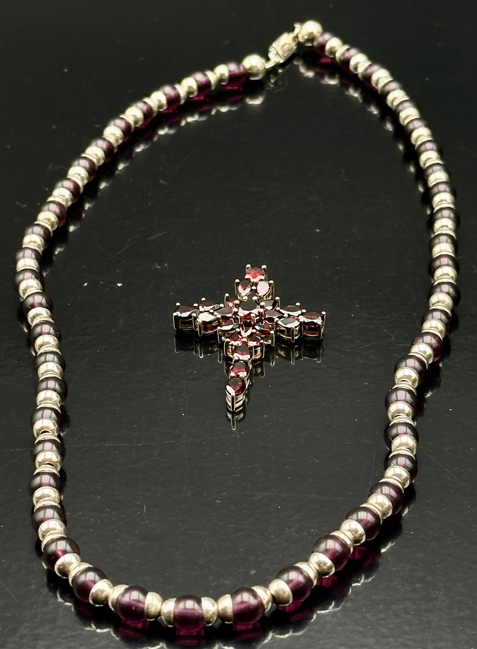 Vintage Garnet Bead Necklace w/ Sterling 925 Garnet Cross – 74g: Beautiful vintage garnet bead necklace with sterling silver spacers. Comes with a matching 925 garnet cross pendant. Necklace has sterling clasp. Total weight 74 grams. Deep wine-red garnet color, ver