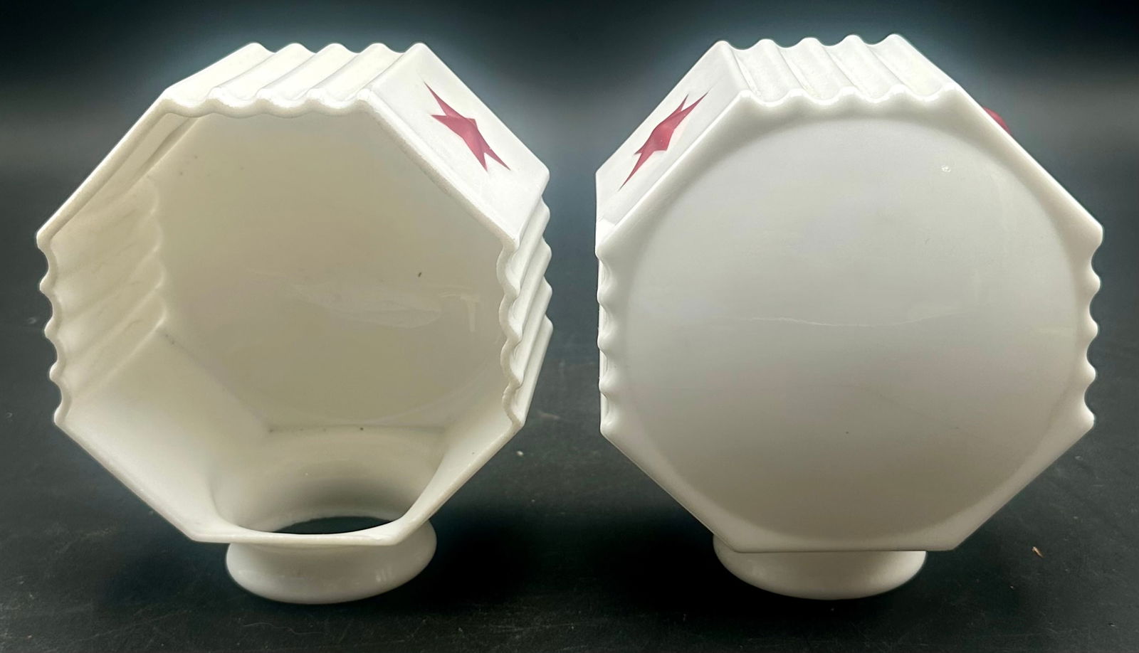 Pair 1920s Milk Glass Auto/Carriage Lamp Shades w/ Red Stars: Pair of vintage 1920s–30s milk glass lamp shades used on early automobile or carriage kerosene/oil lamps. Octagon-shaped bodies with ribbed sides and red star decoration. Each shade has a round bott
