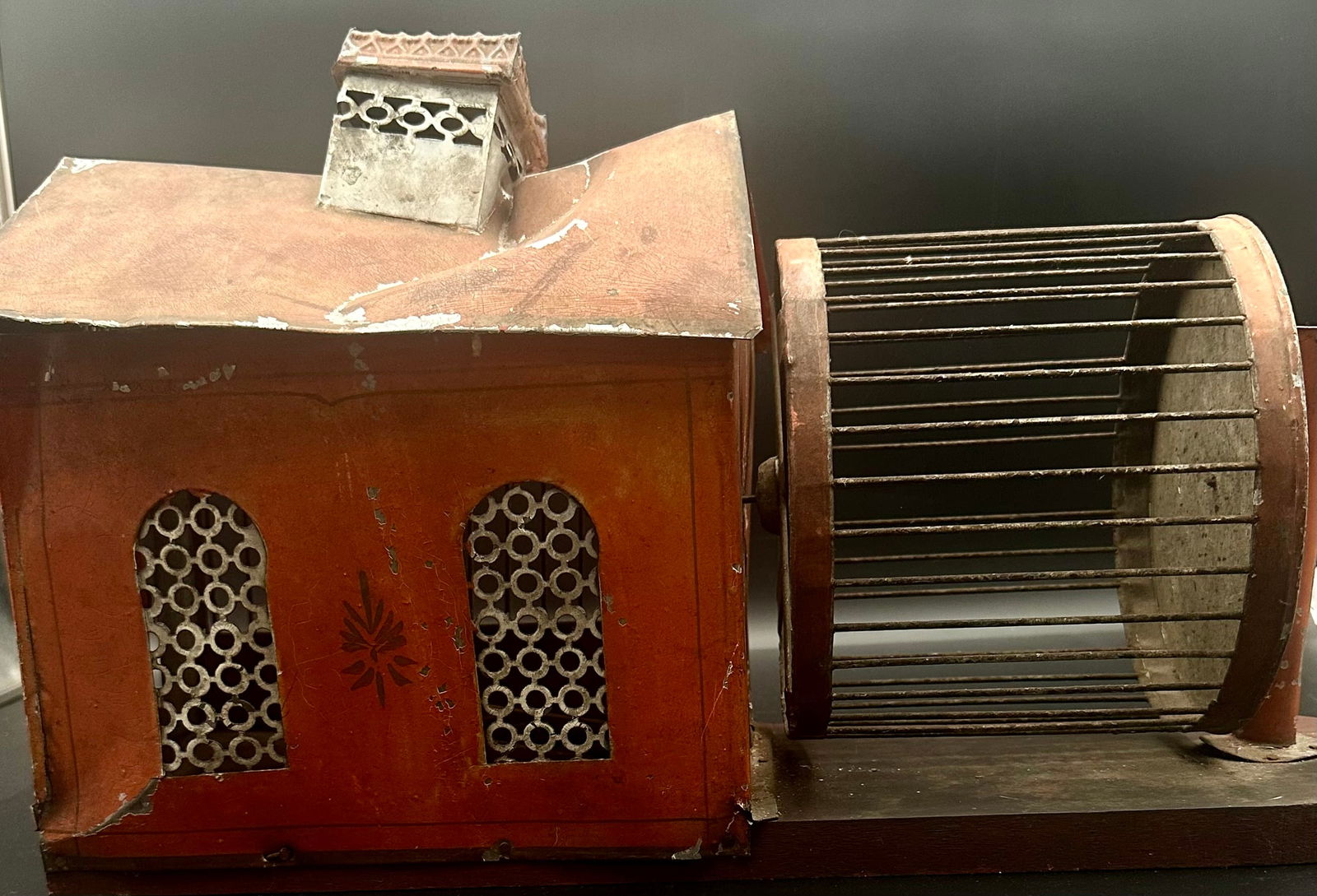 Antique Folk Art Tin Squirrel Cage House, 19th C.: Antique American folk art tin squirrel cage, designed in the form of a small house, dating to the 19th century. Constructed of tin with an original painted surface, featuring pierced metal window pane