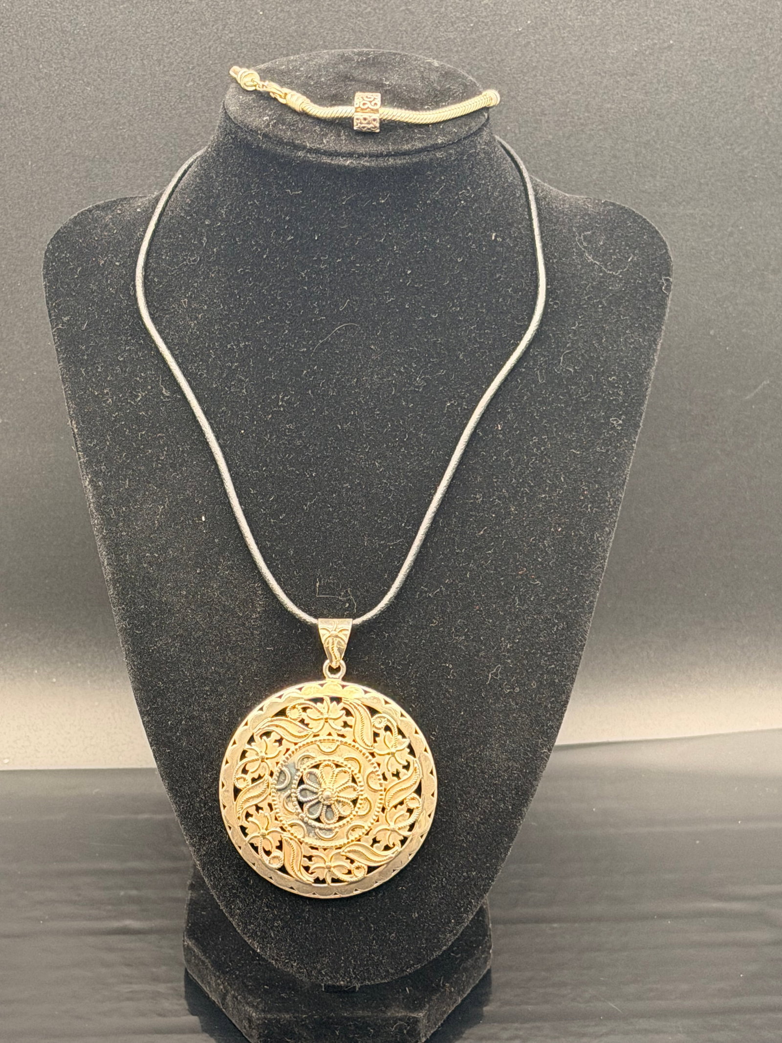 Sterling Silver 925 Filigree Pendant on Cord Necklace (Clasp Marked 14K): Large handcrafted sterling silver filigree pendant (marked dp 925 INDIA) on a black cord necklace. The clasp is stamped 14K, but the cord itself is not gold.