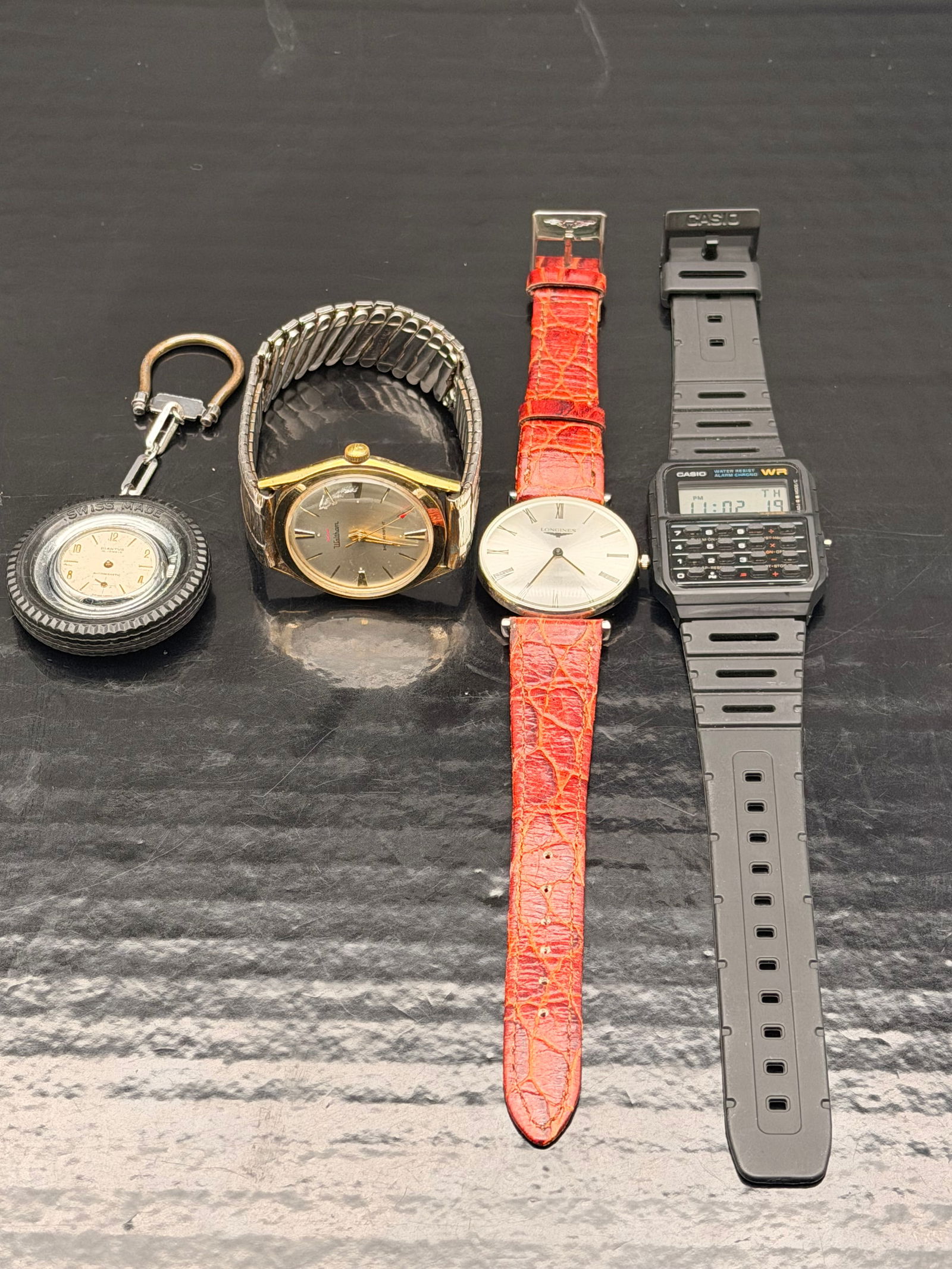 Vintage & Modern Mixed Watch Lot – Longines, Waltham, Casio, Swiss Keychain (5 Watches): Lot of five mixed watches, includes both vintage and modern styles. Brands include Longines Swiss Made, Waltham, Casio CA-53W Calculator Watch, unbranded Swiss Made keychain watch, and one unbranded d