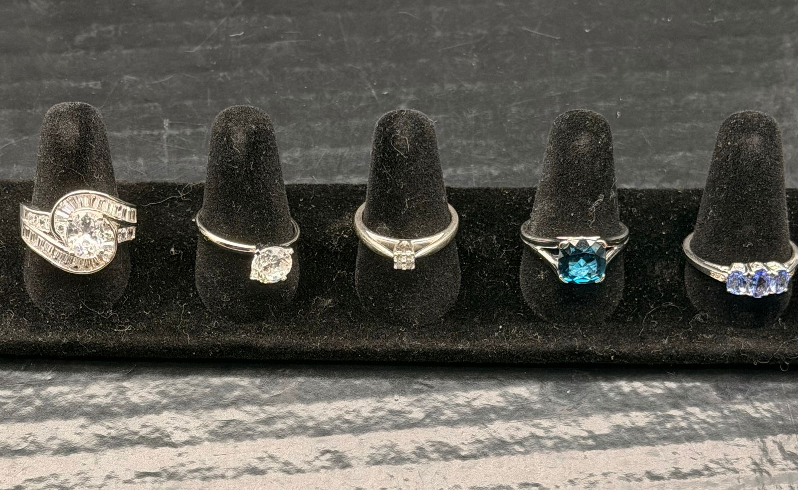 Lot of 4 Sterling Silver Rings – CZ Stones – 21g Total Weight – Marked 925: Beautiful mixed lot of four sterling silver rings, all marked 925. Each ring features clear CZ stones with classic solitaire and multi-stone styles.