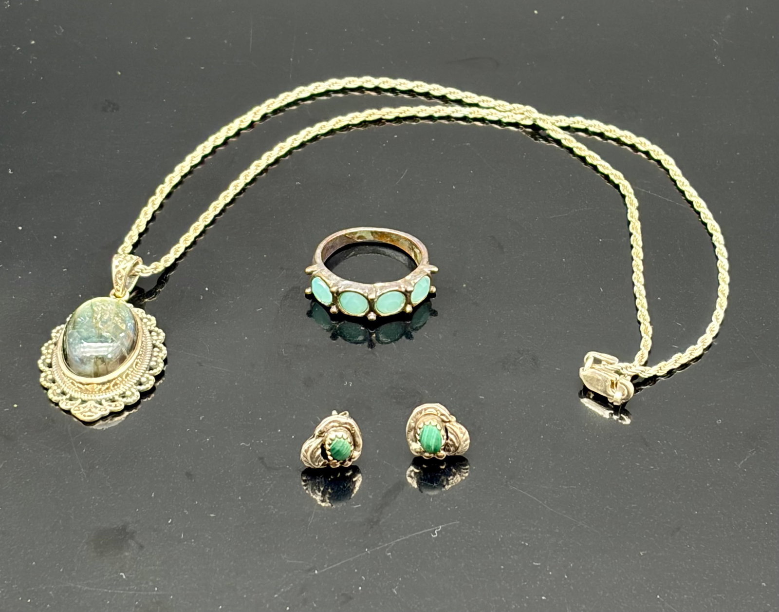Sterling Turquoise Band, Earrings & Pendant Necklace: Vintage sterling silver jewelry trio featuring a bold oval turquoise cabochon pendant, a matching pair of turquoise stud earrings, and a coordinating turquoise inlay band ring. The pendant showcases a