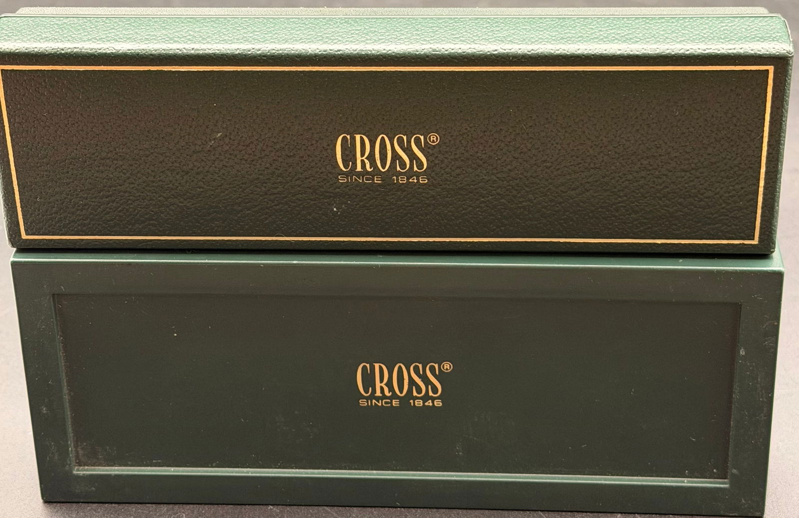 Cross Chrome Pen & Pencil Set (Green Box), Cross Black & Gold Pen & Pencil Set (Green Box): A classic vintage Cross matching set featuring a chrome ballpoint pen and mechanical pencil in their original green velvet-lined case. Both pieces have a clean, reflective finish with light normal han