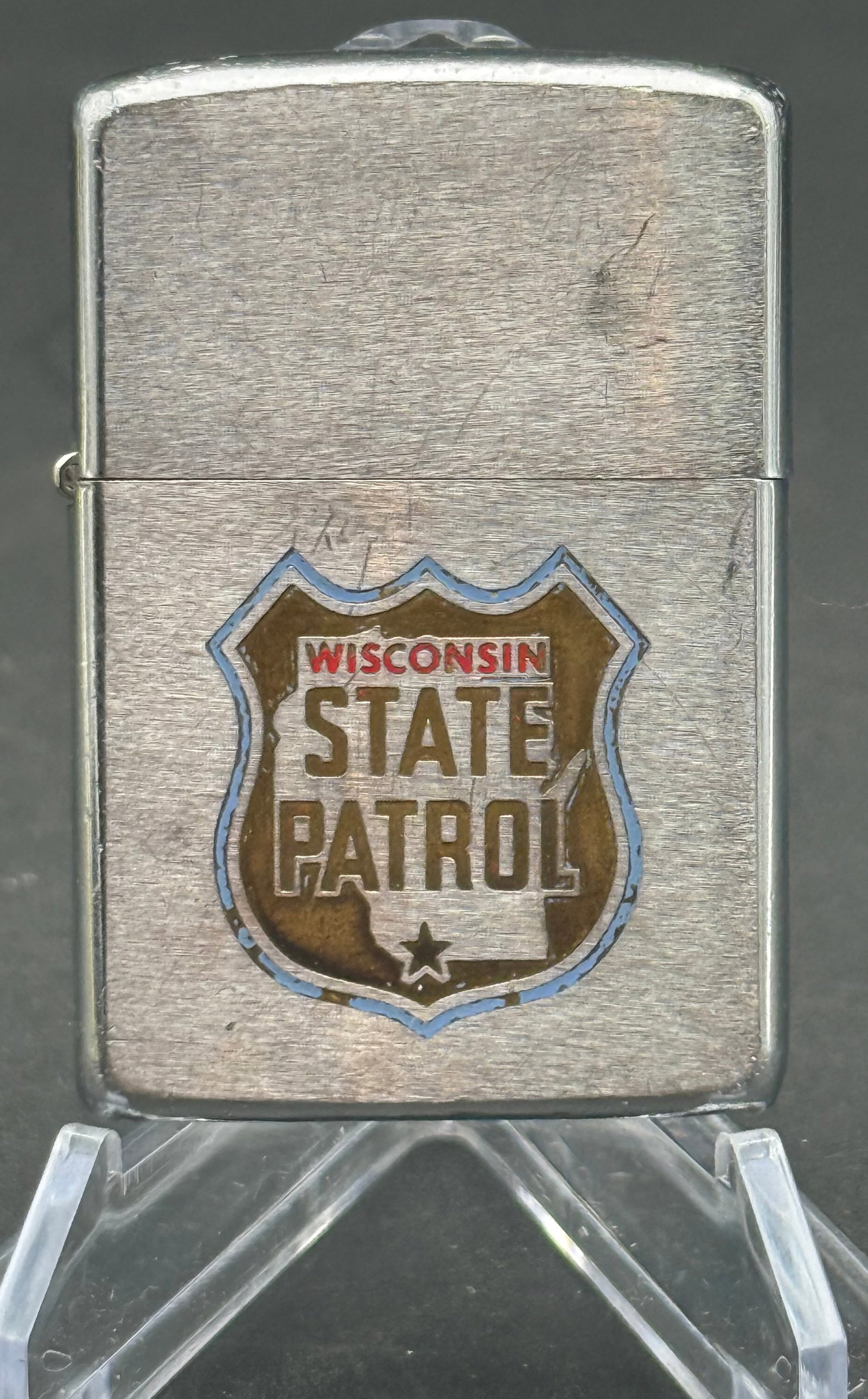 Wisconsin State Patrol Zippo lighter: Wisconsin State Patrol Zippo lighter featuring the agency's official shield emblem.