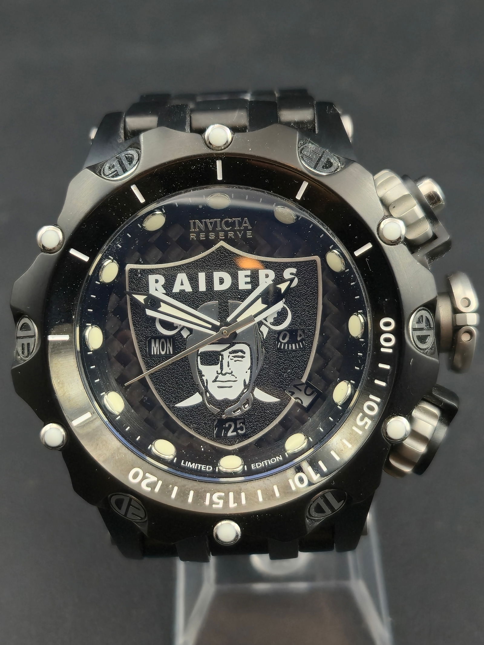 2020 Invicta Reserve Venom Black Label Raiders Limited Edition 53mm Chronograph New Battery: This Invicta Reserve Venom Black Label Raiders edition is a bold limited-production NFL licensed chronograph. Featuring a black ion-plated 53mm case, 500m water resistance, Swiss movement, and a textu