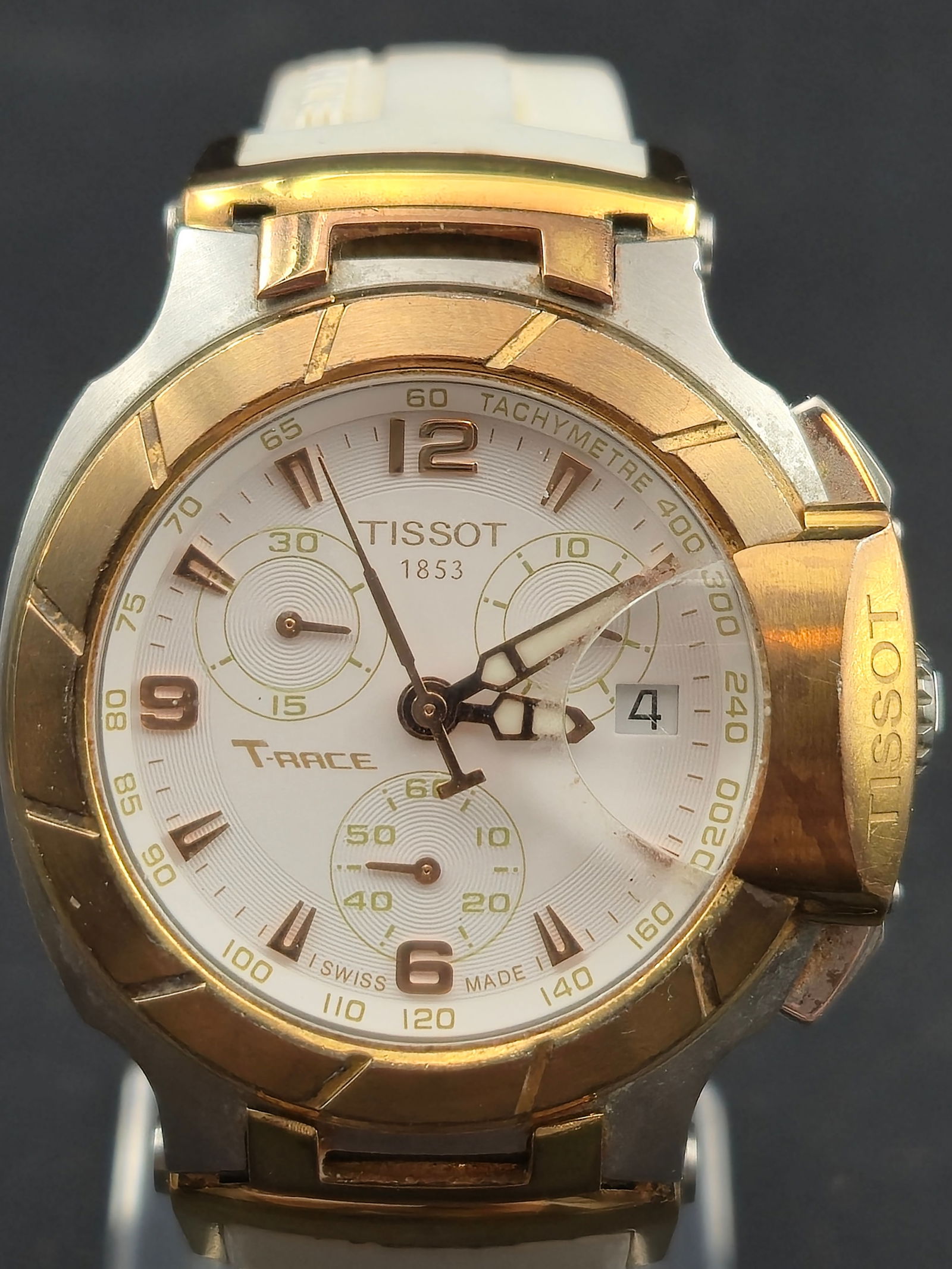 2010 Tissot T-Race Chronograph 37mm Two-Tone White Dial & Rubber Strap New Battery: A sporty 2010 Tissot T-Race chronograph featuring a two-tone steel/gold design, sapphire crystal, white racing-style dial, and functional Swiss quartz chronograph. New battery installed and fully func