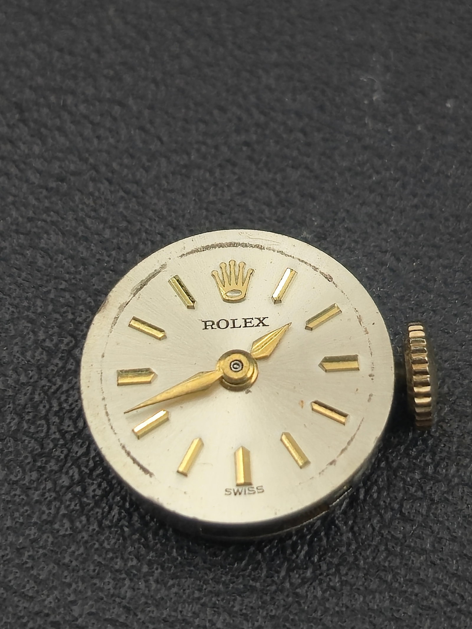 1960s Rolex Cal 1401 Ladies 17J Mechanical Movement Running 13.7mm Diameter Authentic: A genuine 1960s Rolex Caliber 1401 Swiss 17-jewel mechanical movement, complete with silver sunburst dial, gold baton markers, gold hands, and crown. The movement is running and displays the correct A