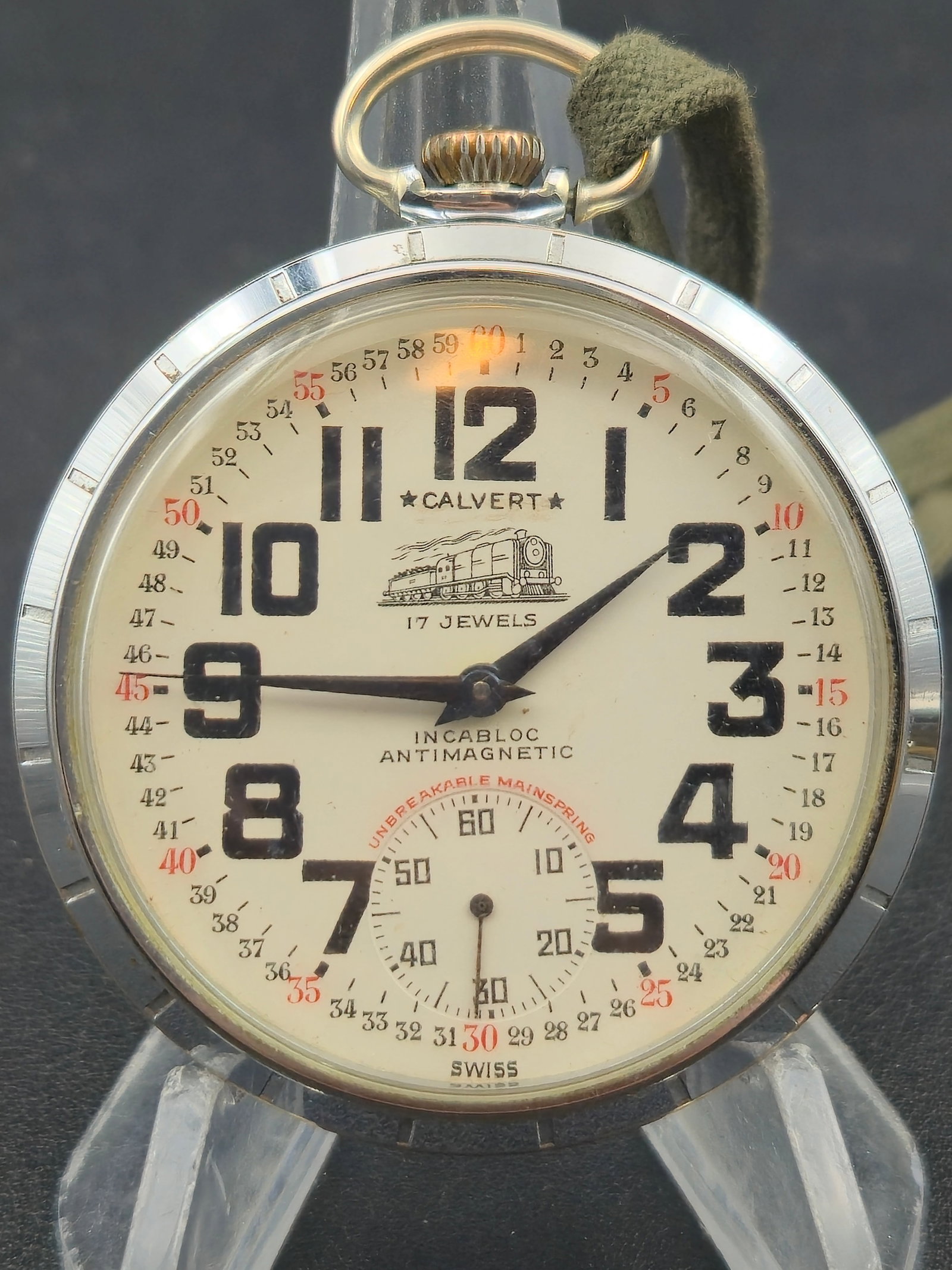 1950s Calvert 50mm Montgomery Dial Pocket Watch 17J Swiss Montilier Runs: vintage 1950s Calvert Swiss pocket watch featuring a bold Montgomery-style dial with full-minute track numbering and large Arabic numerals. Powered by a 17-jewel Montilier Watch Co. movement, this exa